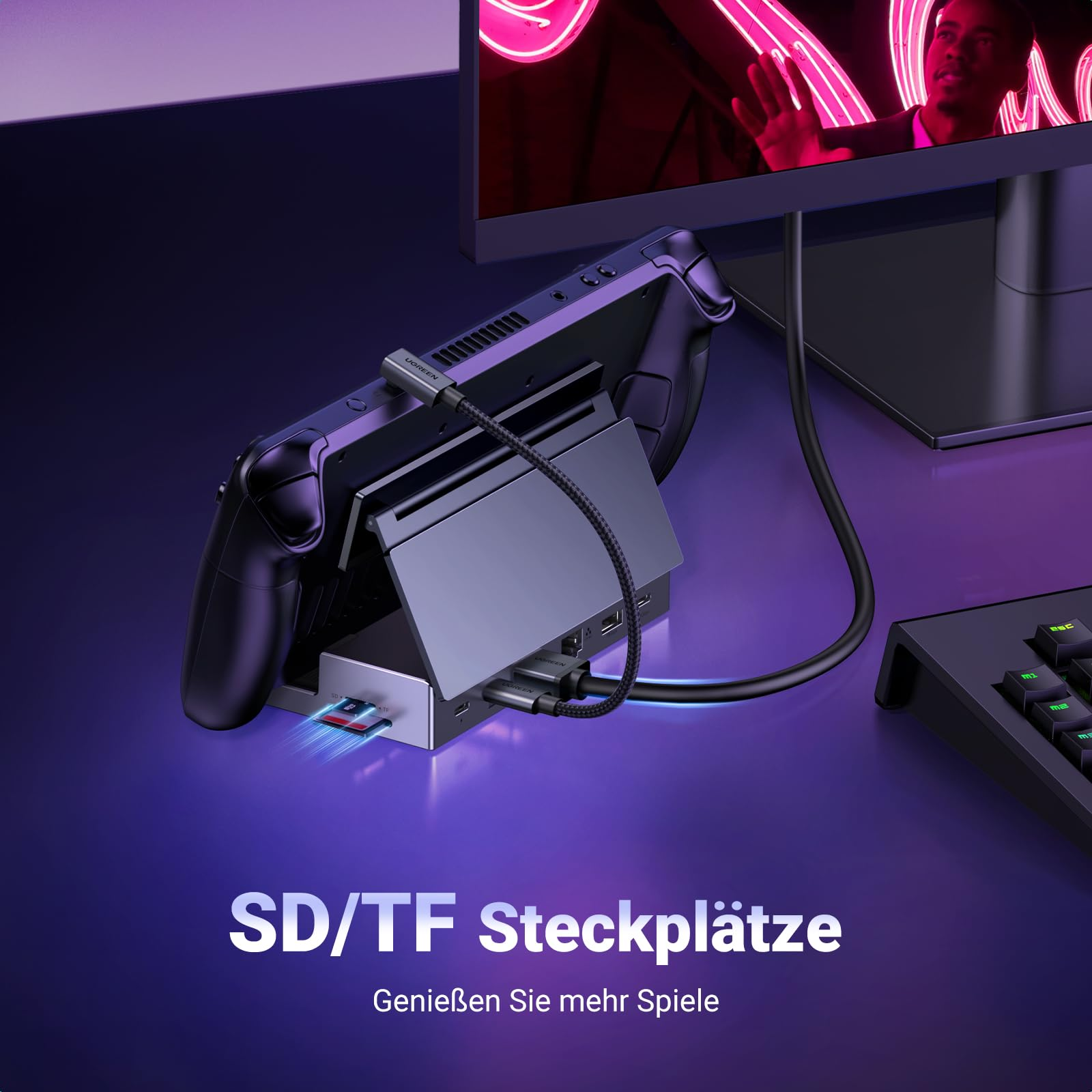 Console portable dans une station d'accueil avec une carte SD insérée.