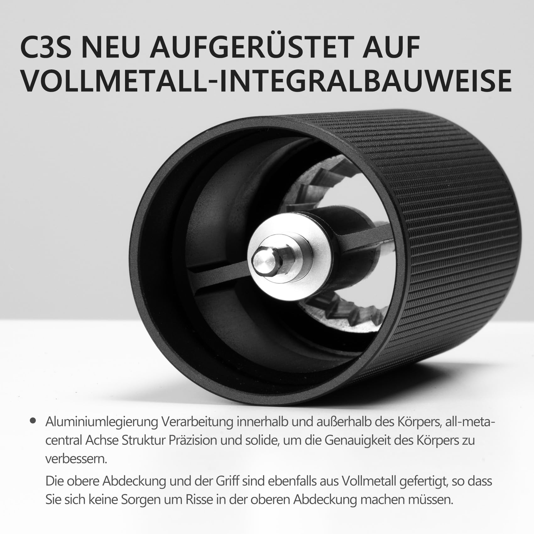 Schwarze Kaffeemühle im Querschnitt mit Metallteilen und Text oben und unten.