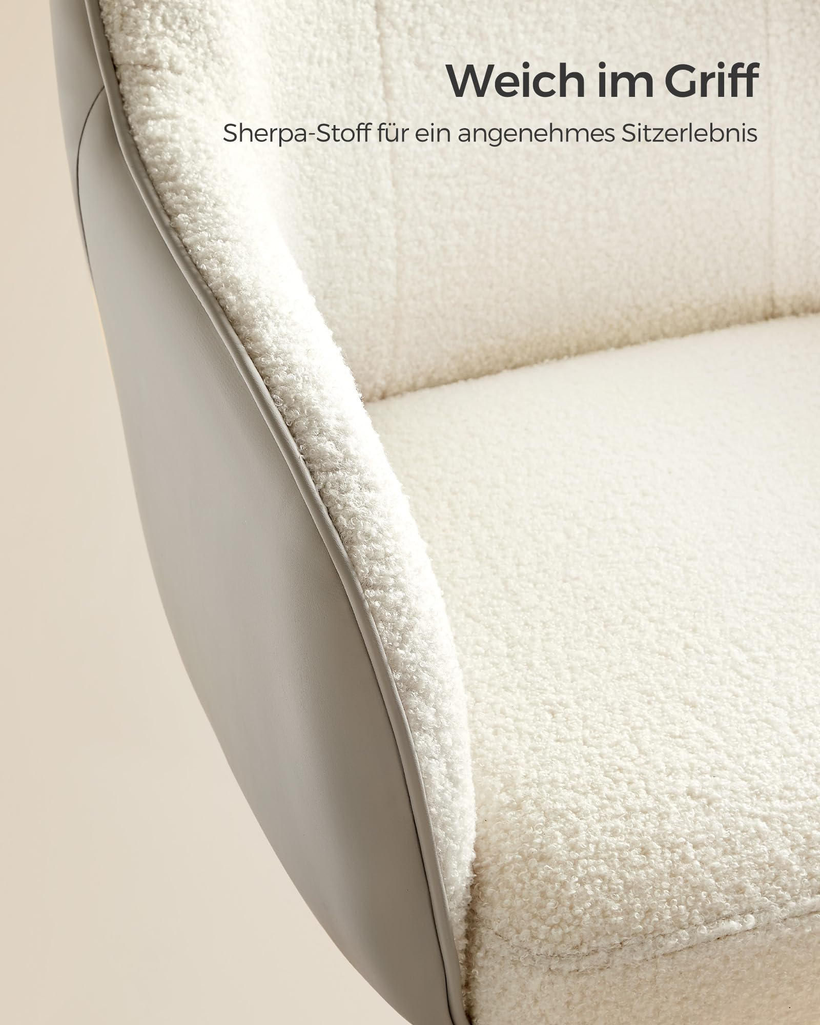 Nahaufnahme eines modernen Sessels mit weissem Sherpa-Stoff und glatten Aussenseiten.