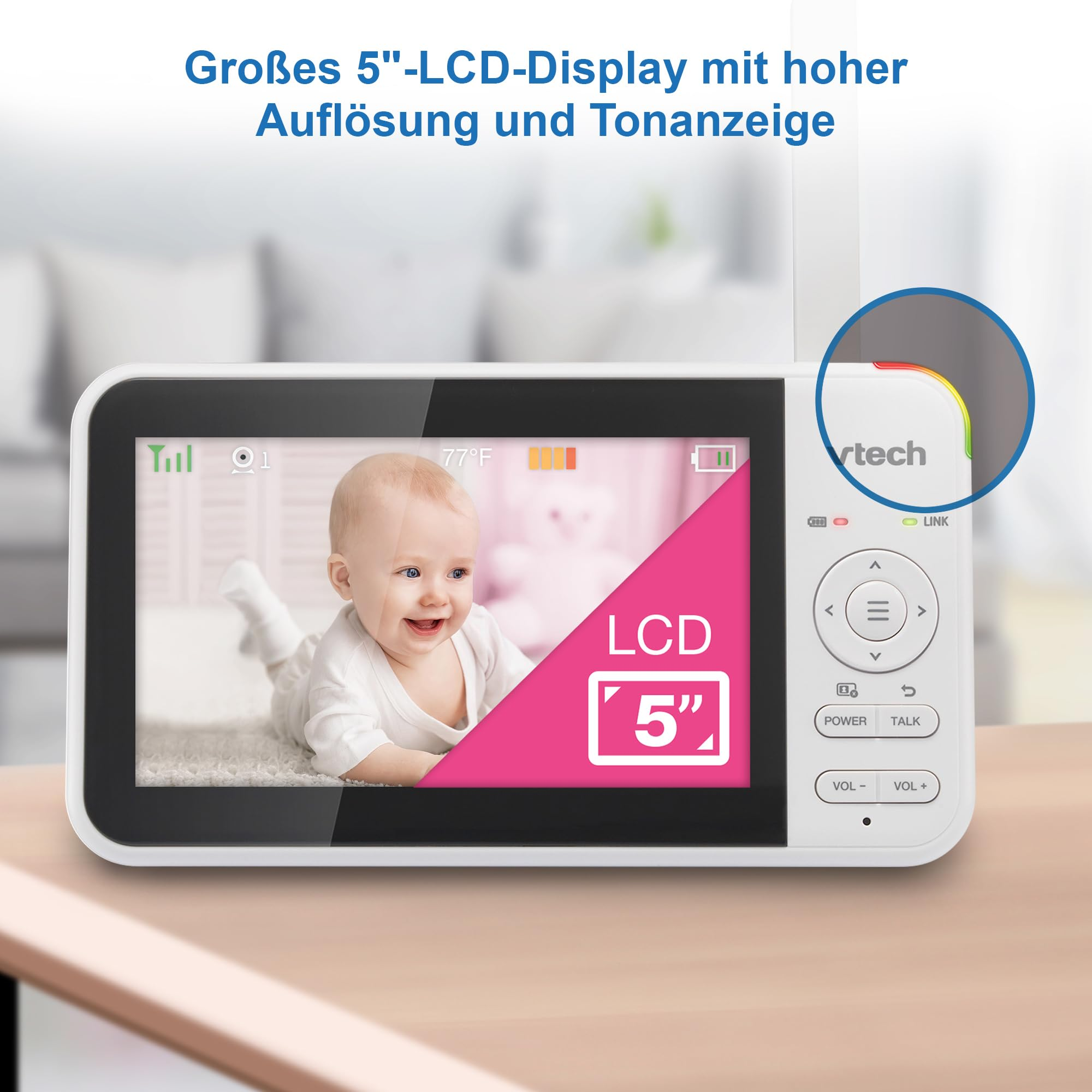 Un baby monitor bianco con un grande schermo LCD da 5 pollici che mostra un bambino sorridente.