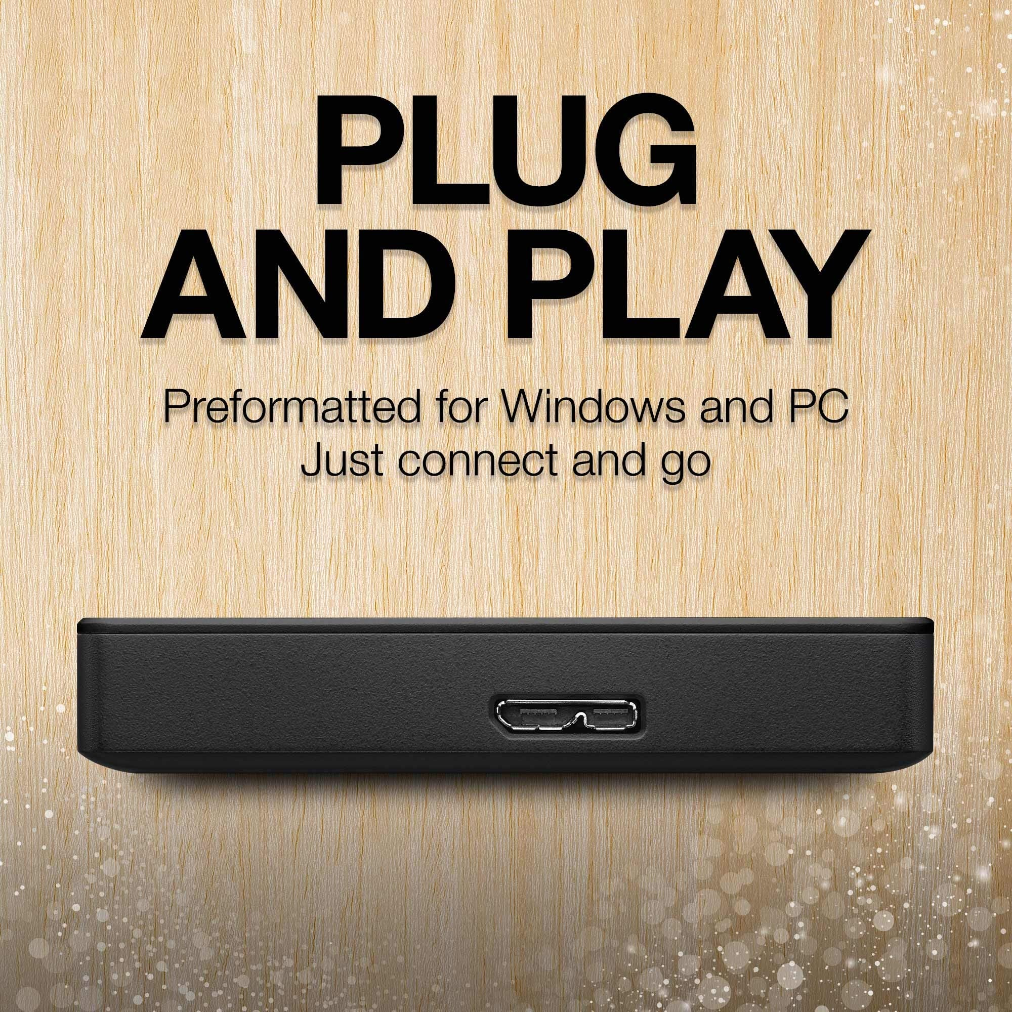 Schwarzes externes Laufwerk auf Holzmaserung mit dem Text Plug and Play, Preformatted for Windows and PC.