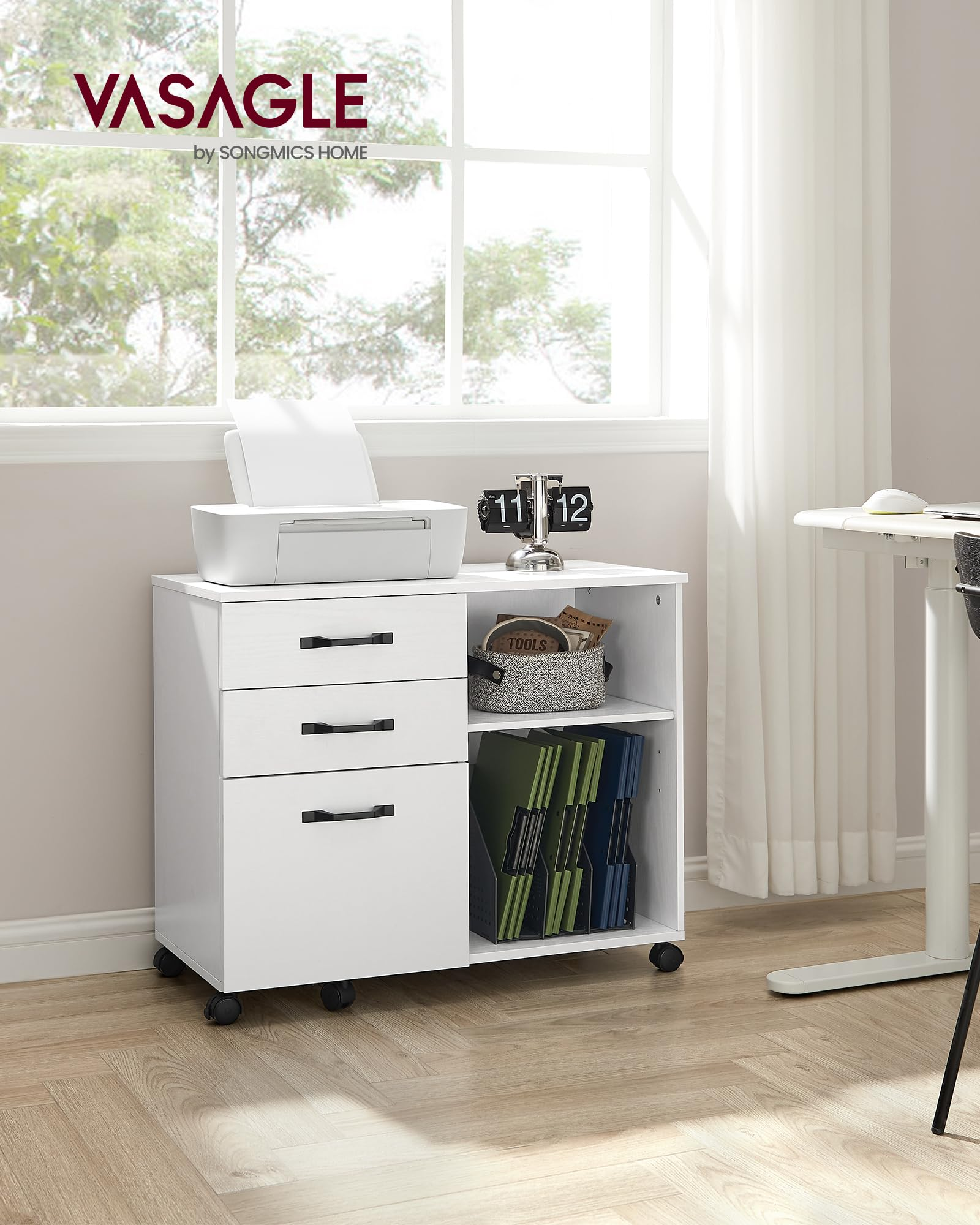 Un caisson de bureau blanc à roulettes avec trois tiroirs, une imprimante et des dossiers.