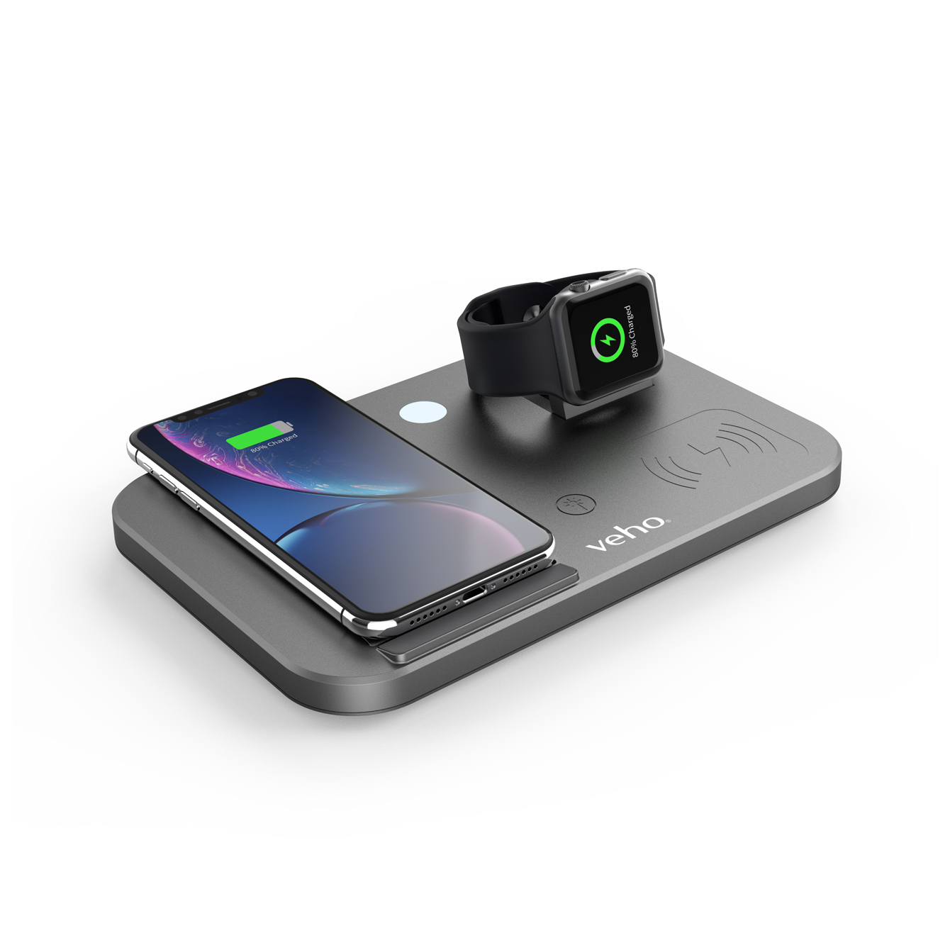 Eine graue Veho-Ladestation lädt ein Smartphone und eine Smartwatch auf weißem Hintergrund.