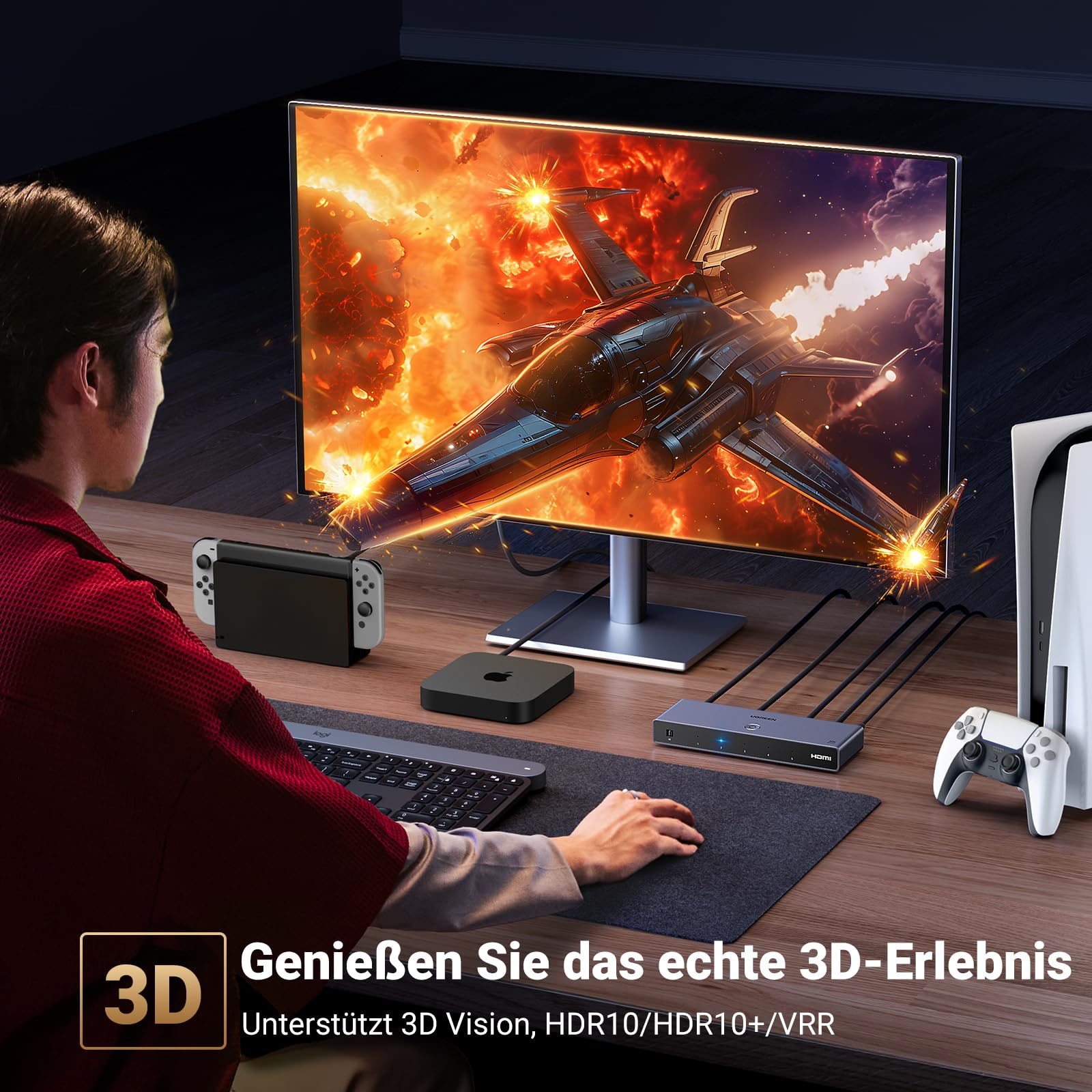 Un joueur est assis au bureau et regarde un moniteur avec une scène de bataille spatiale.