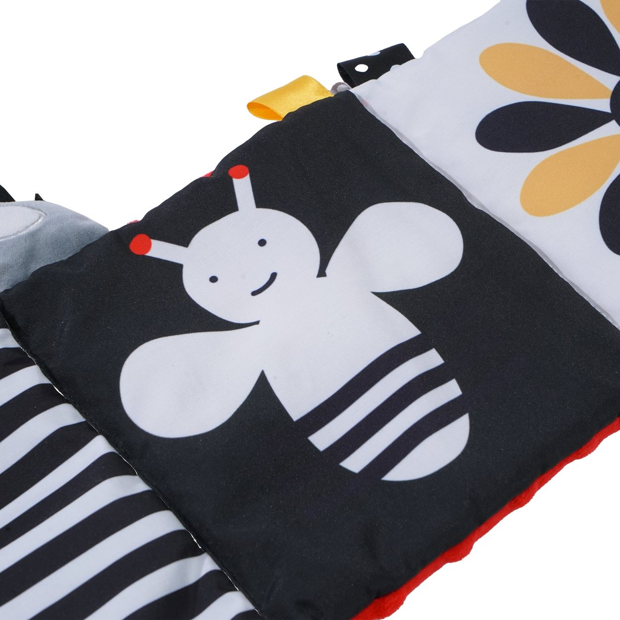 Eine schwarz-weiße Babystoffbuchseite zeigt eine weiße Bienenillustration mit gestreiftem Körper und Fühlern.