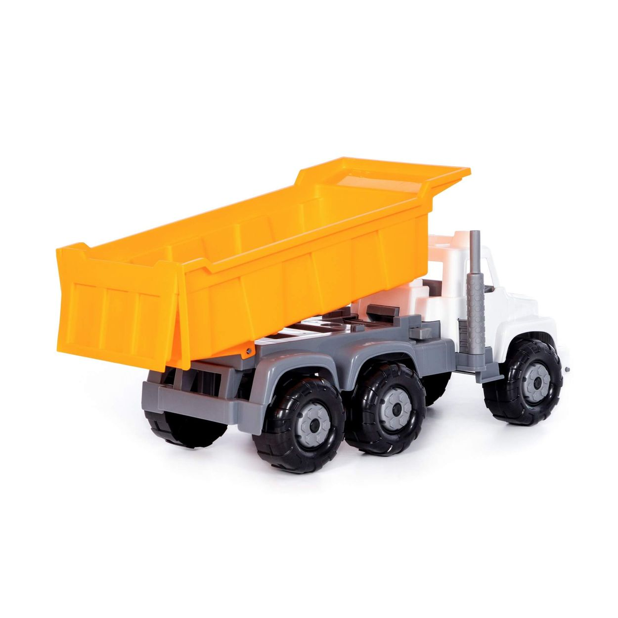 Ein großer Spielzeuglastwagen mit weißem Fahrerhaus, grauen Details und einer kippbaren orangen Ladefläche.