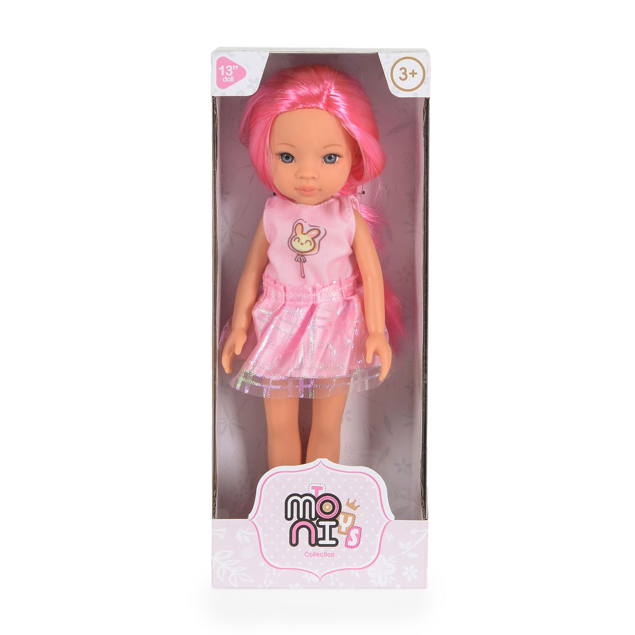Eine 33 cm große Puppe mit pinkem Haar in einem passenden pinken Kleid, verpackt in einer weißen Schachtel.
