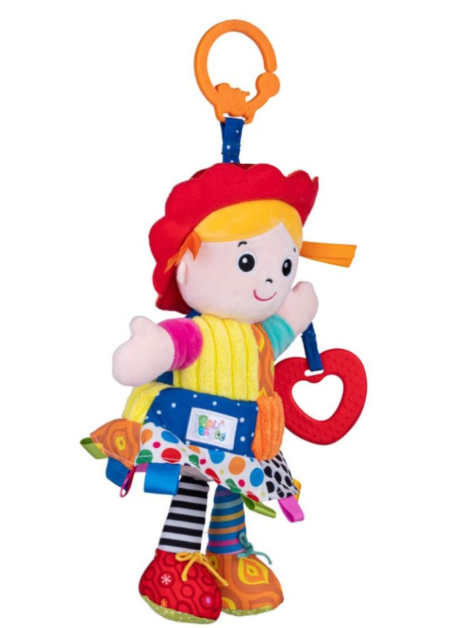 Bunte Stoffpuppe mit rotem Hut, gelbem Haar und einem roten Herz-Beißring, an einem Orangen Ring aufgehängt.