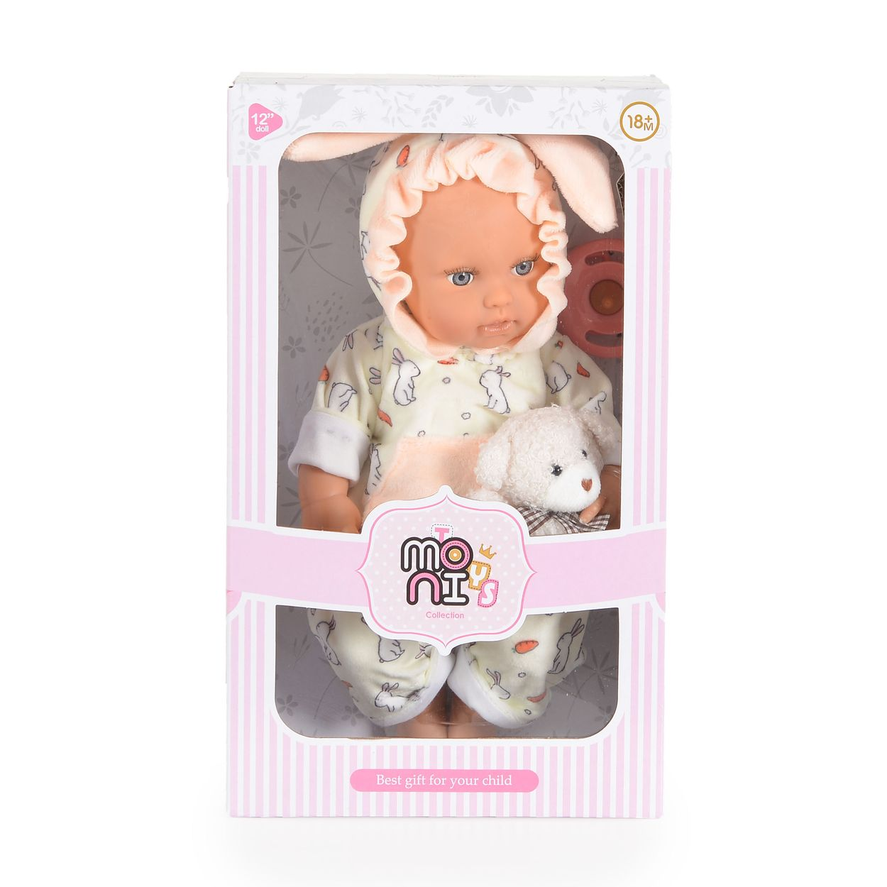 Eine Babypuppe mit Hasenohren im gelben Anzug und Plüschtier, verpackt in einer rosafarbenen Geschenkbox.