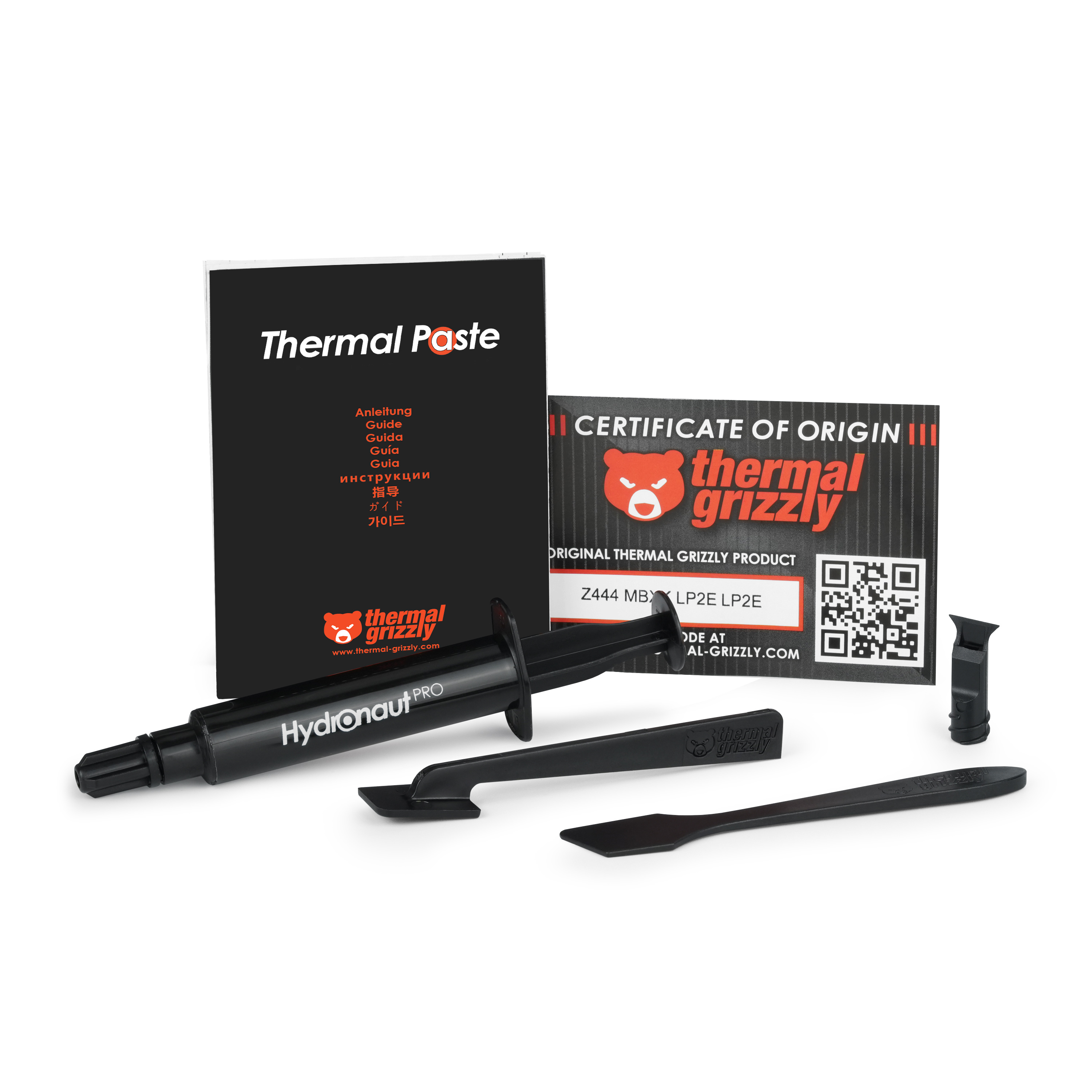Thermal Grizzly Hydronaut Pro Wärmeleitpasten-Set mit Spritze, Anleitung, Werkzeugen und Herkunftszertifikat.