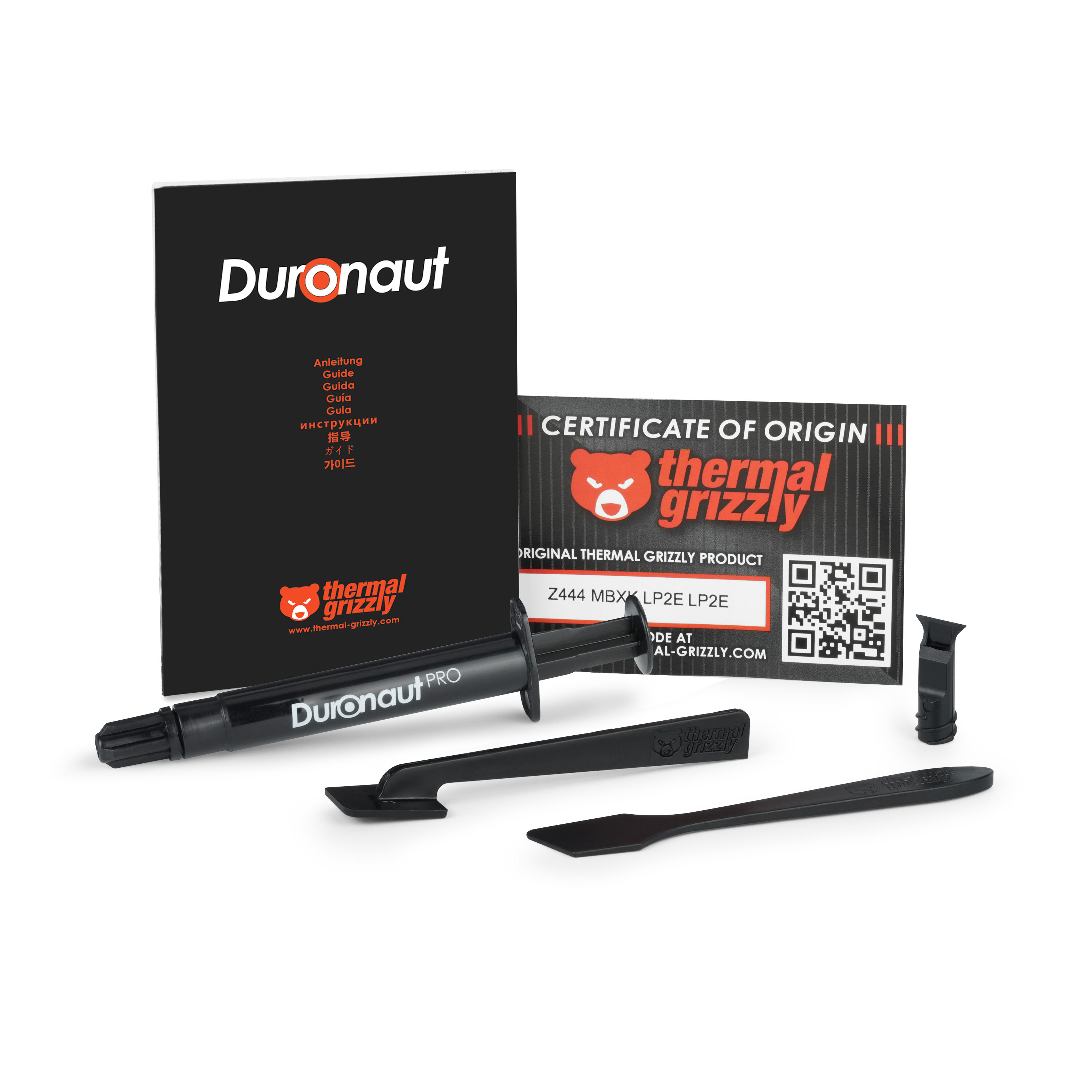 Duronaut Pro Wärmeleitpaste-Set mit schwarzer Spritze, Anleitung, Ursprungszeugnis und Anwendungswerkzeugen.
