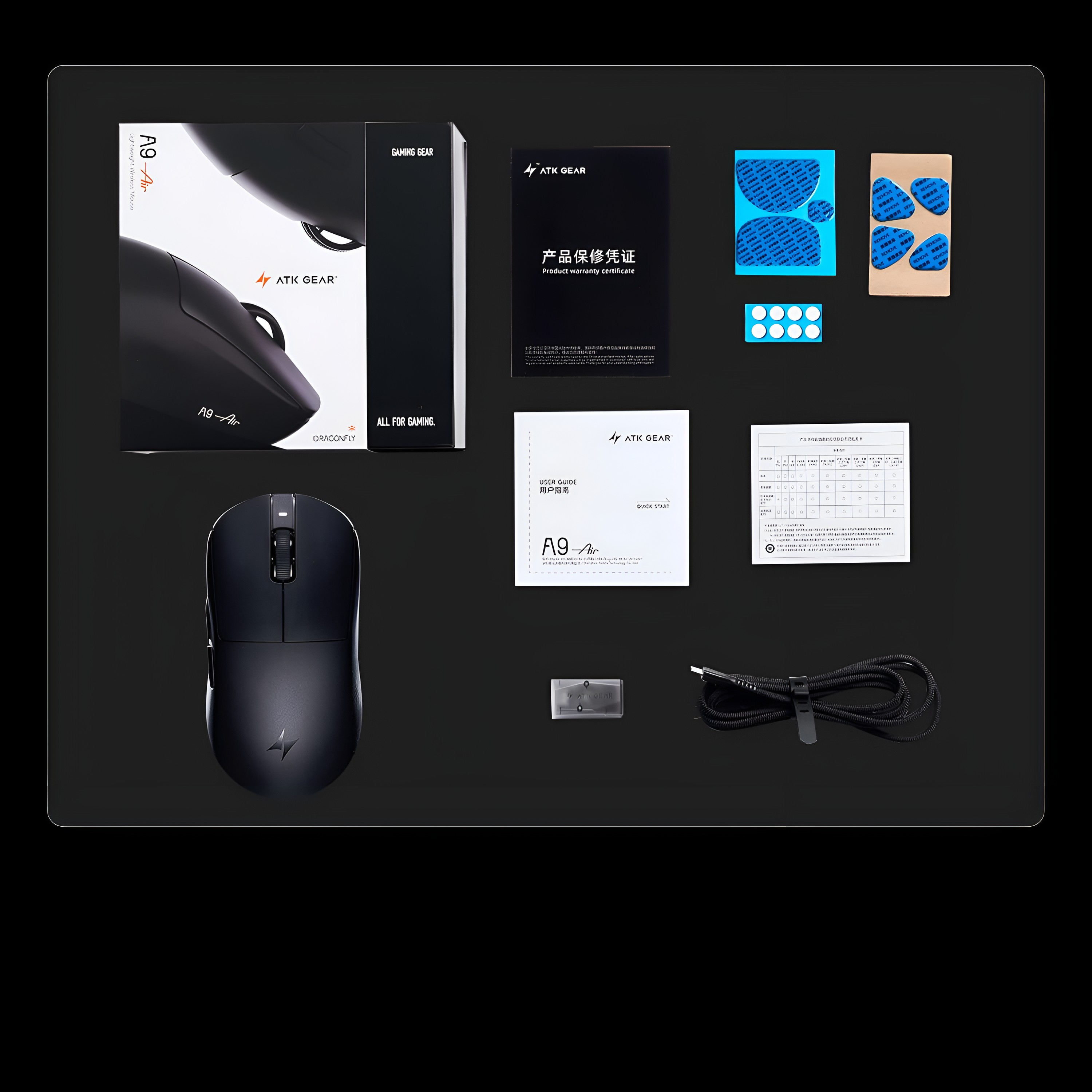 Zestaw myszy gamingowej ATK Gear A9 Air z pudełkiem, akcesoriami, instrukcjami i kablem na ciemnym tle.