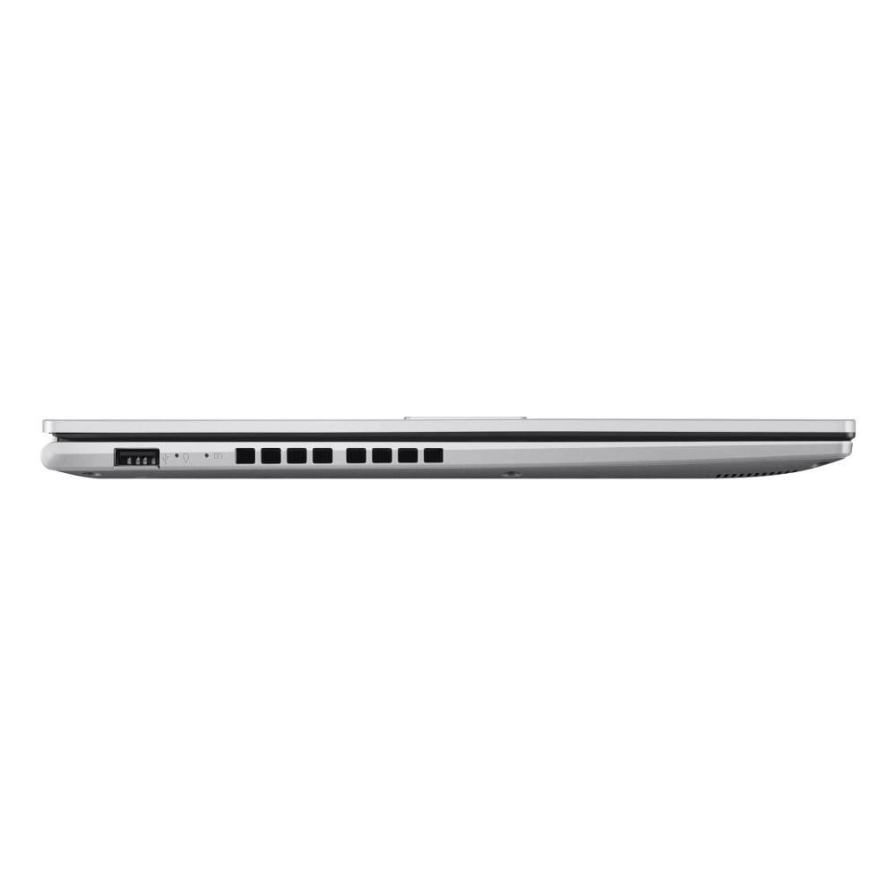 Widok z boku zamkniętego srebrnego laptopa z portem USB i szczelinami wentylacyjnymi na białym tle.