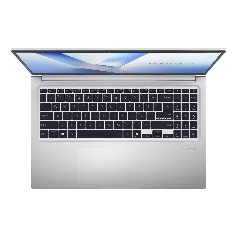 Widok z góry na otwarty srebrny laptop z czarną klawiaturą, blokiem numerycznym i niebieską tapetą.