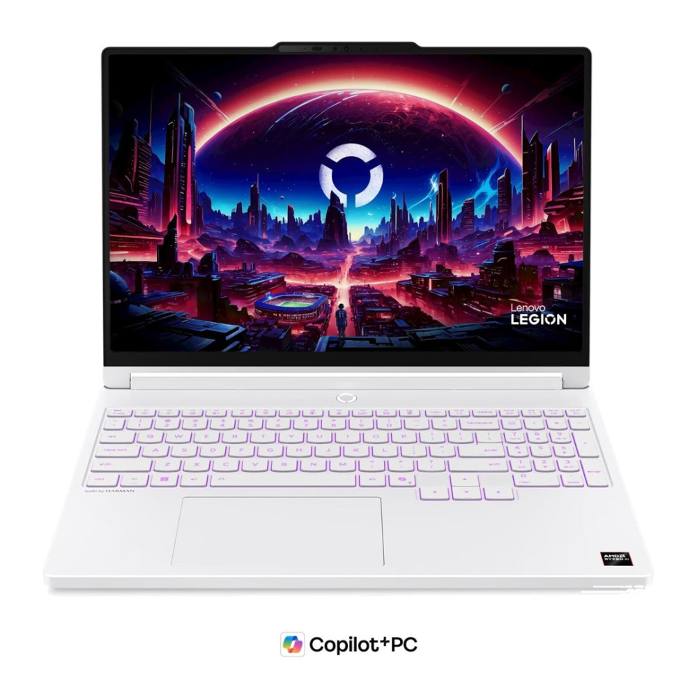 Biały laptop Lenovo z wyrazistą futurystyczną tapetą miasta na ekranie oraz podświetlaną klawiaturą.