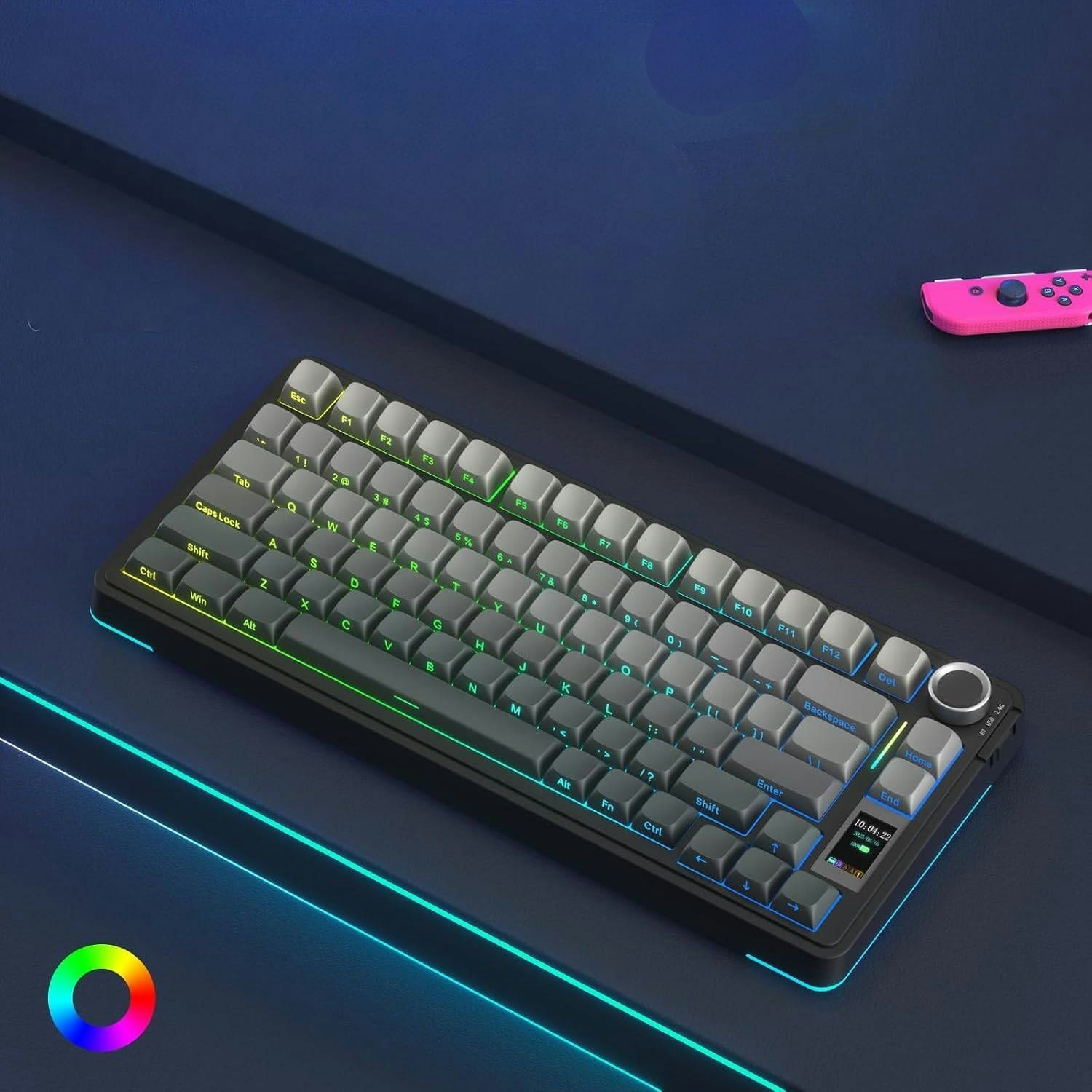 Kompaktowa czarna klawiatura z szarymi klawiszami i podświetleniem RGB na niebieskim tle.