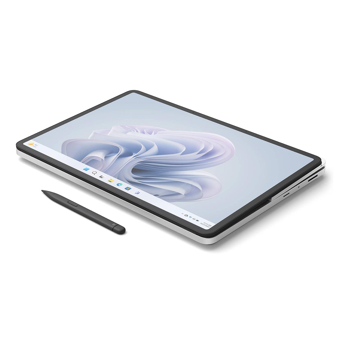 Srebrny tablet ze rysikiem leżącym obok na białej powierzchni.