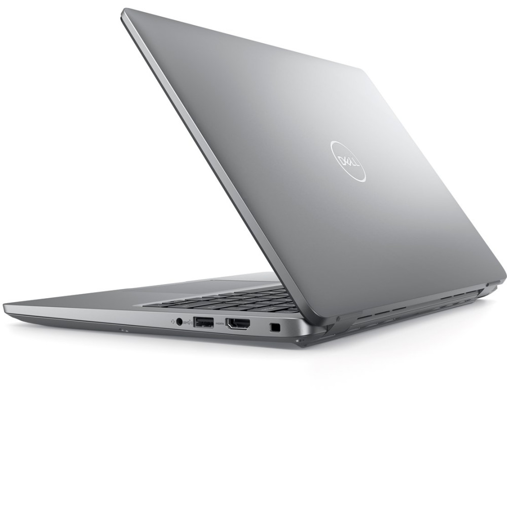 Szary laptop Dell jest lekko otwarty, sfotografowany z boku na białym tle.