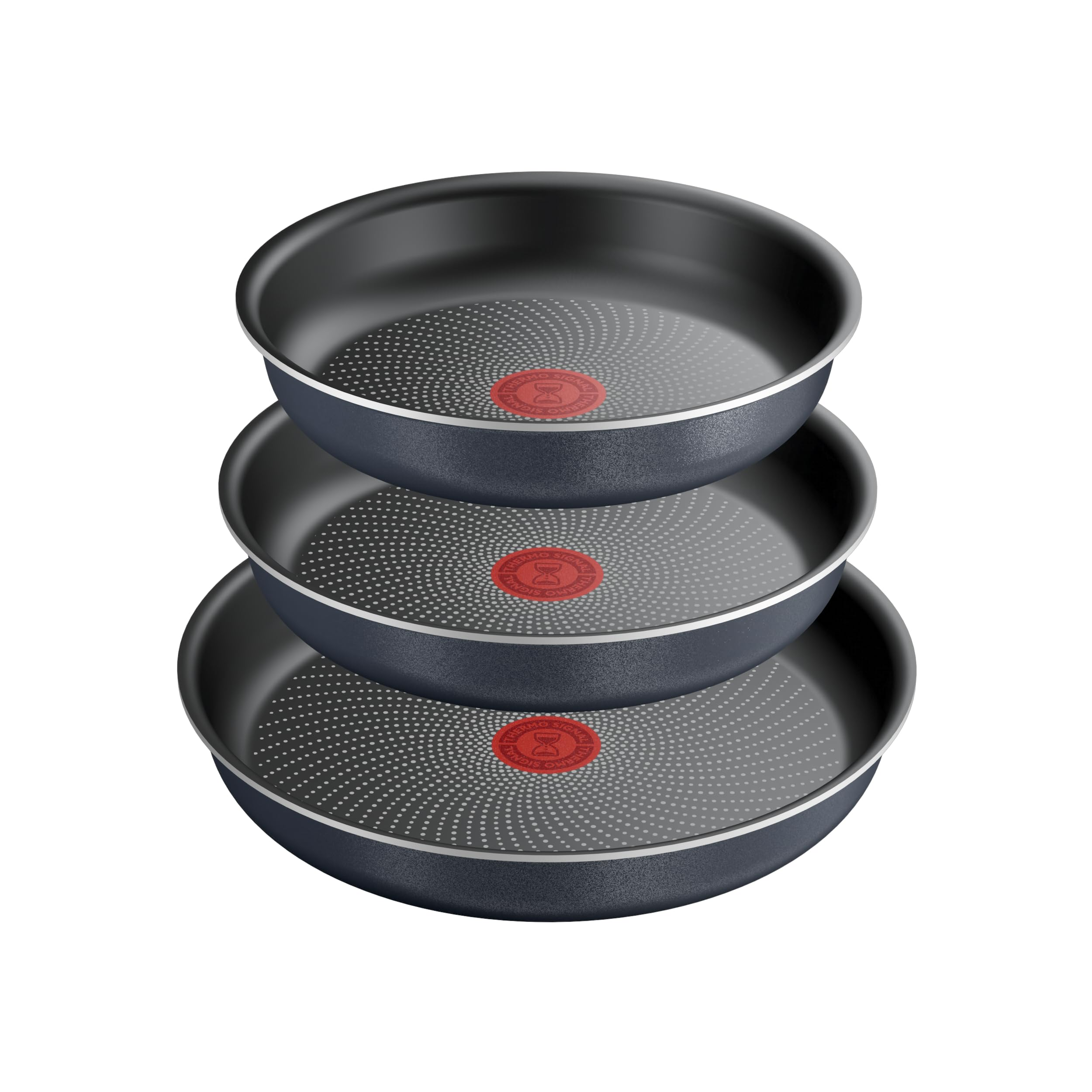 Trois poêles gris foncé avec des cercles rouges au centre sont soigneusement empilées sur fond blanc.