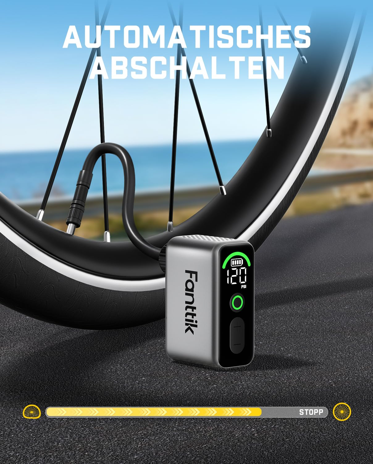 Compresseur d'air portable Fanttik gonflant un pneu de vélo sur une route.