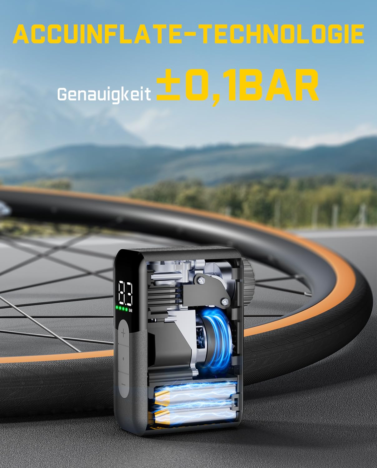 Mini compressore compatto con corpo sezionato davanti a una gomma di bicicletta e montagne sullo sfondo.