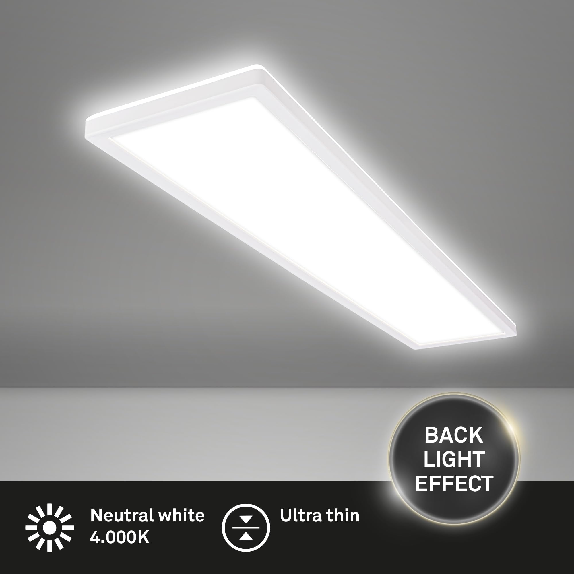 Una plafoniera LED rettangolare con luce bianca neutra e effetto controluce montata su un soffitto grigio.