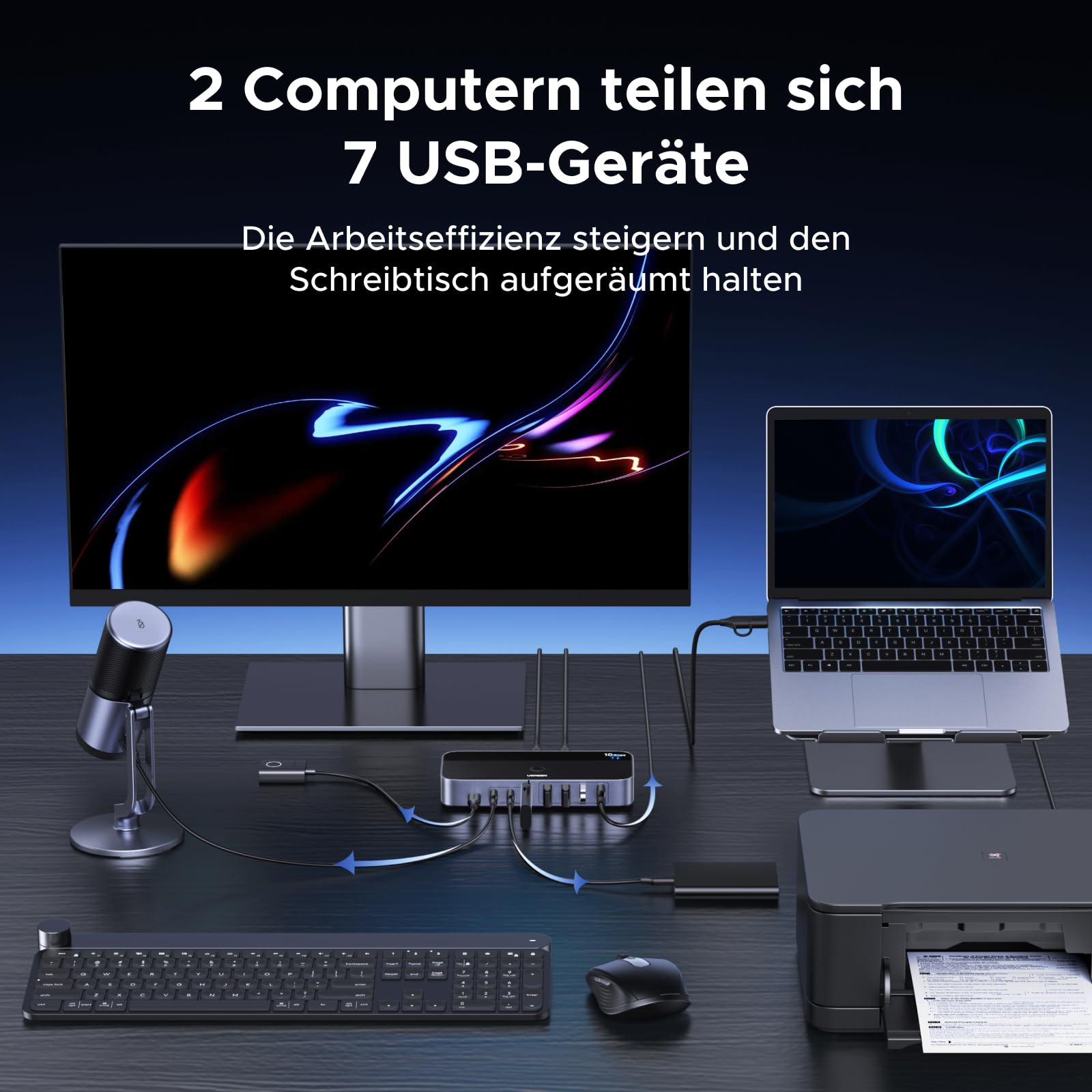 Uno switch USB collega due computer a sette dispositivi USB su una scrivania.