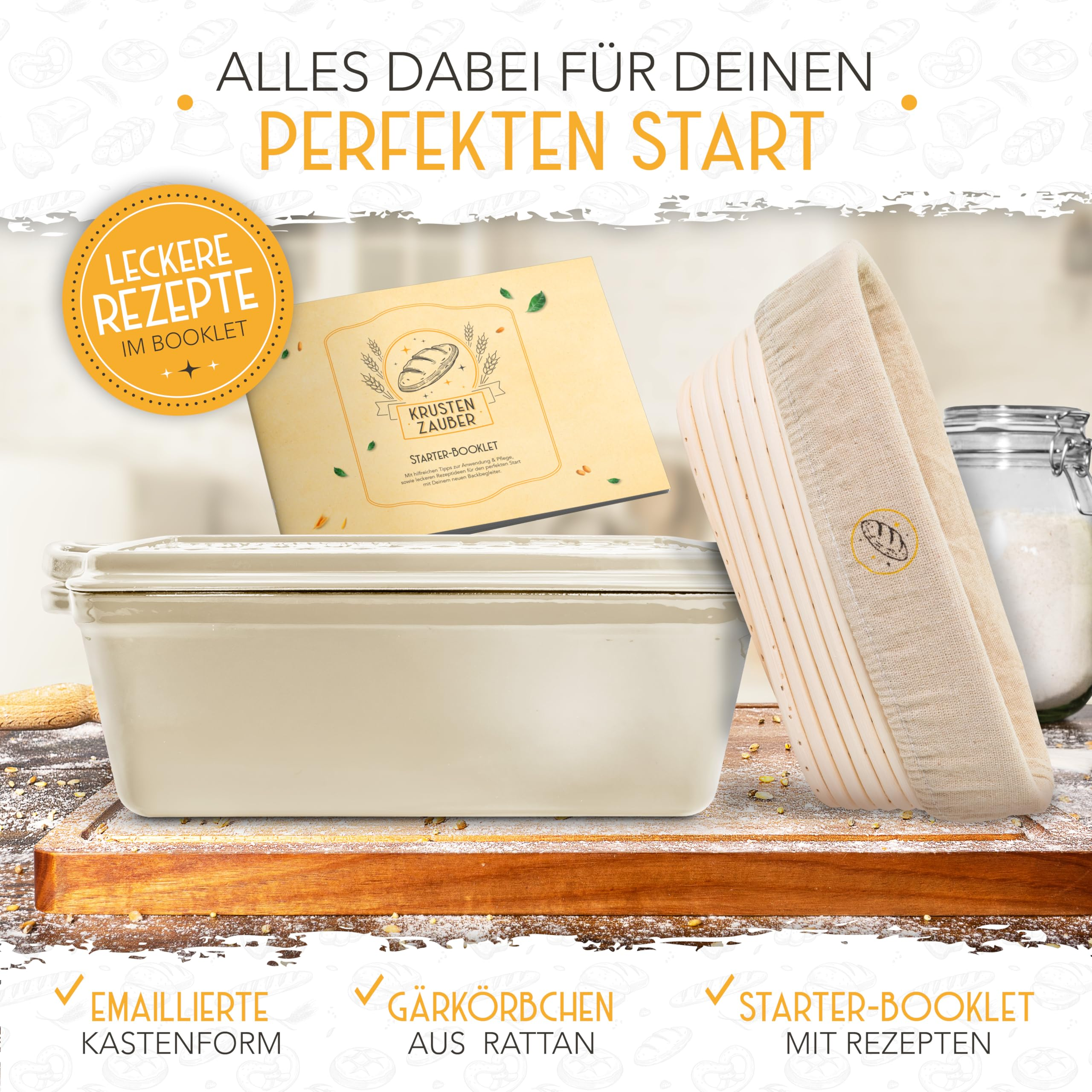 Brotbackset mit emaillierter Kastenform, Rattangärkörbchen und Rezeptheft auf Holztisch.