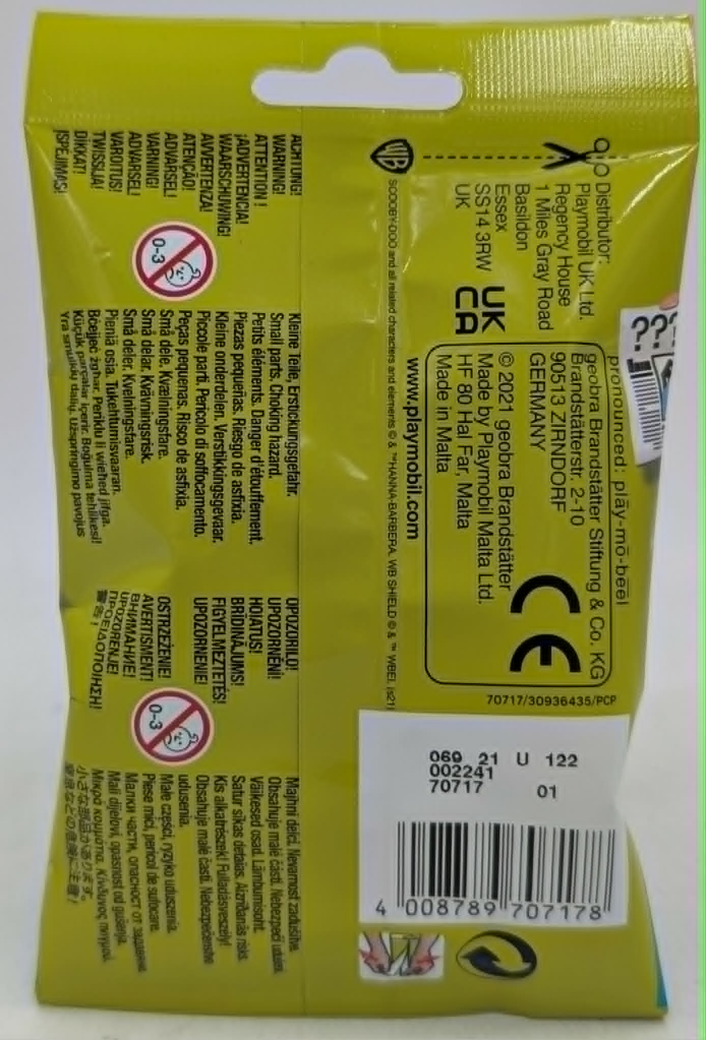 Rückseite einer gelben Playmobil-Verpackung mit Warnhinweisen, CE-Kennzeichnung und einem Strichcode.