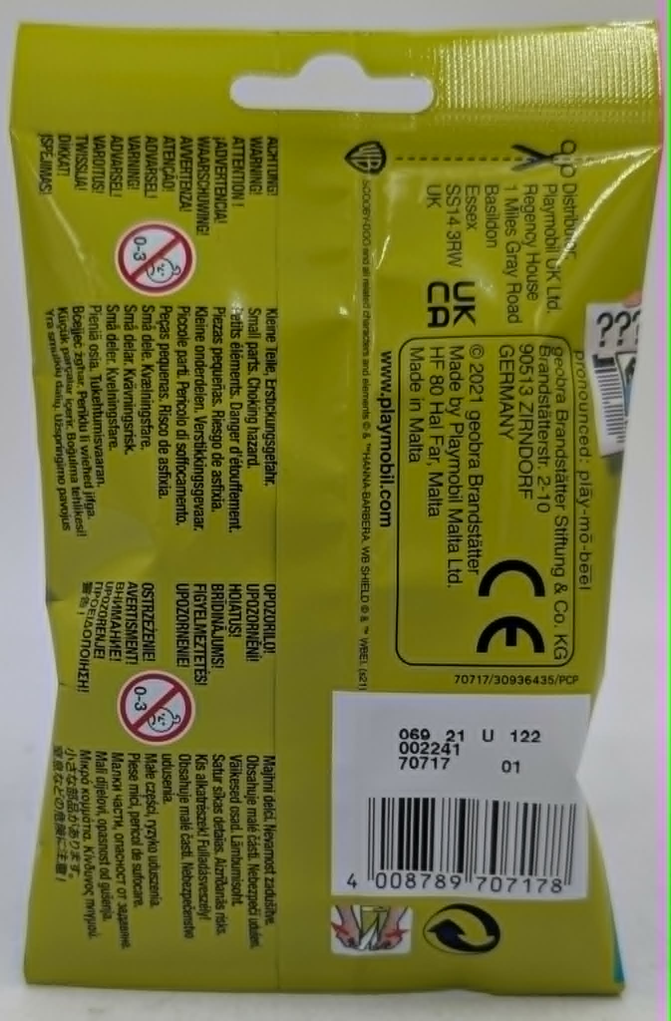 Rückseite einer gelben Playmobil-Verpackung mit Warnhinweisen und Barcode.
