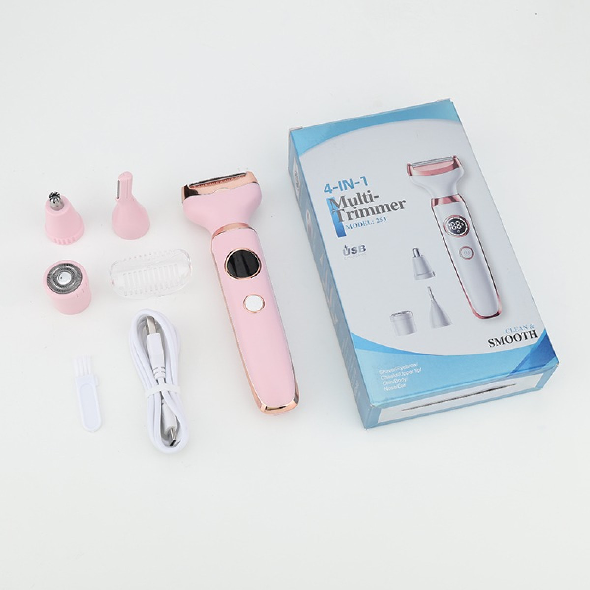 Rosa 4-in-1-Multitrimmer mit Aufsätzen, Ladekabel und blau-weißer Verpackung auf weißem Hintergrund.