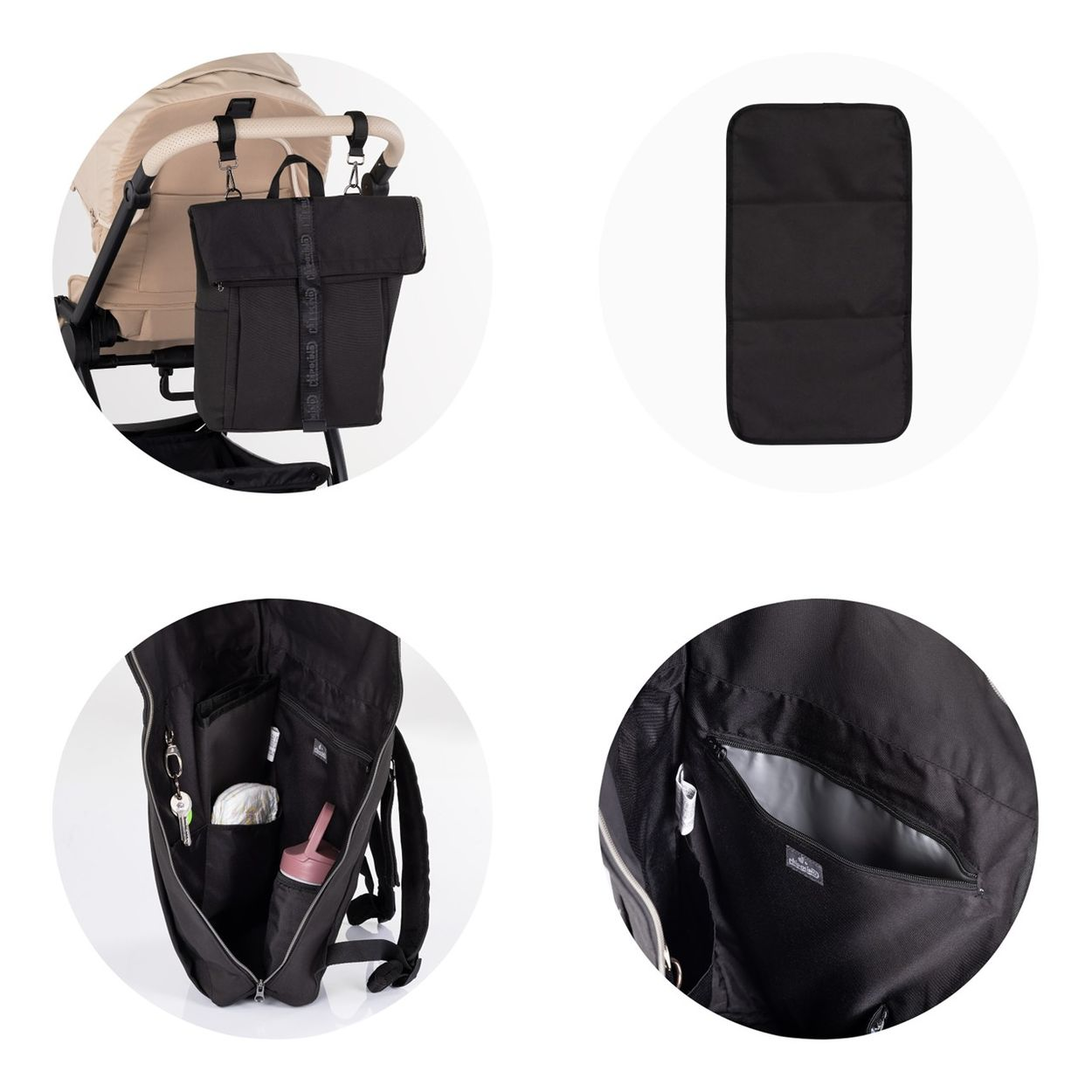Schwarze Wickeltasche mit Zubehör, am Kinderwagen befestigt und geöffnet mit Fächern.