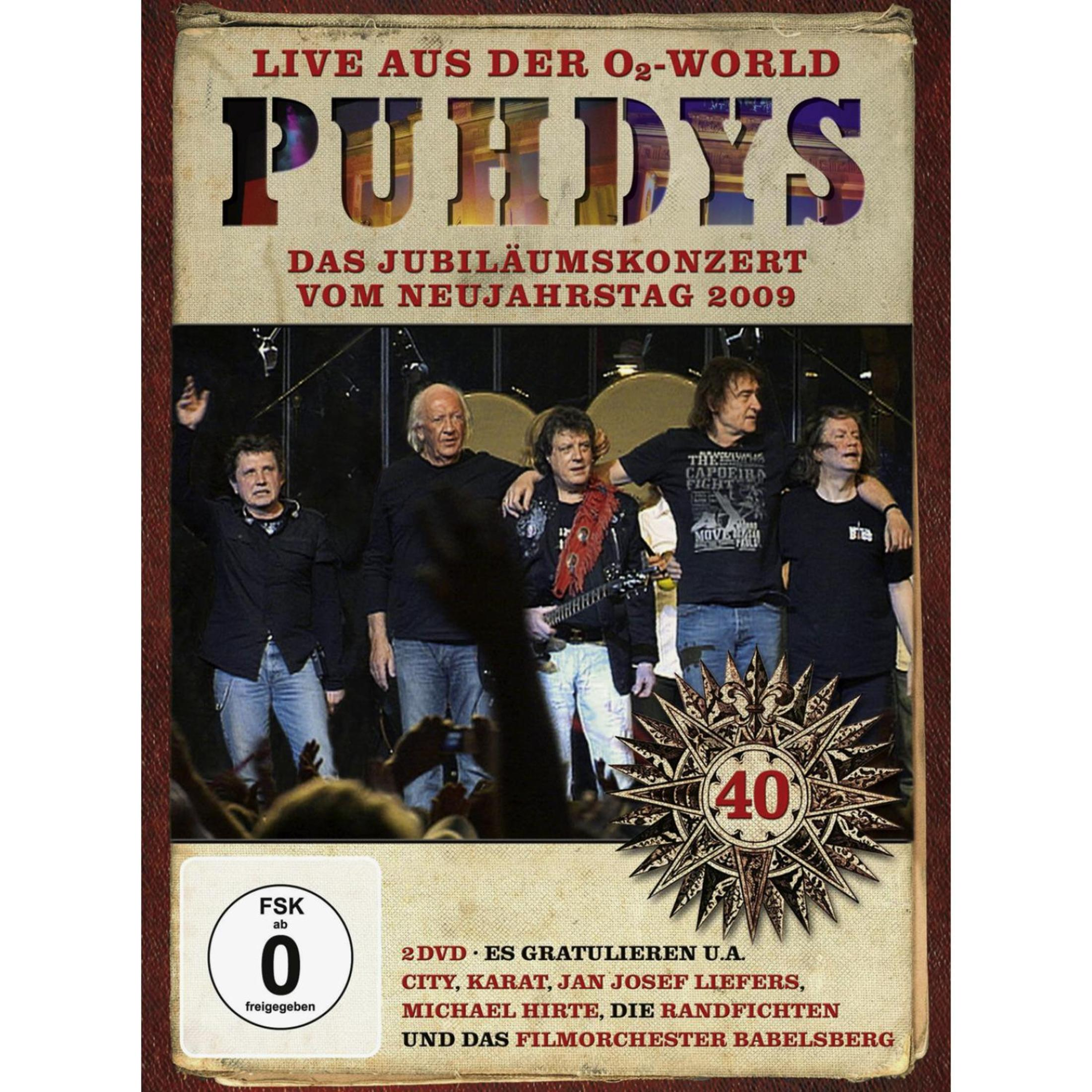DVD-Cover der Band Puhdys live in der O2-World 2009, mit Bandmitgliedern auf der Bühne und einem 40-Jahre-Jubiläumslogo.