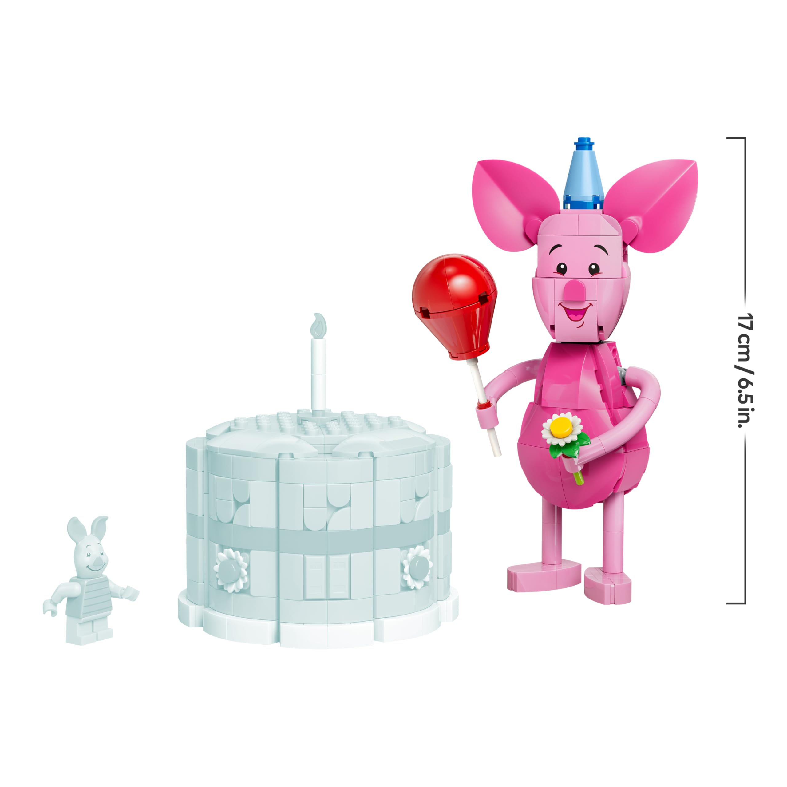 Figura Lego di Pimpi con palloncino rosso e fiore, accanto a una torta con candela.