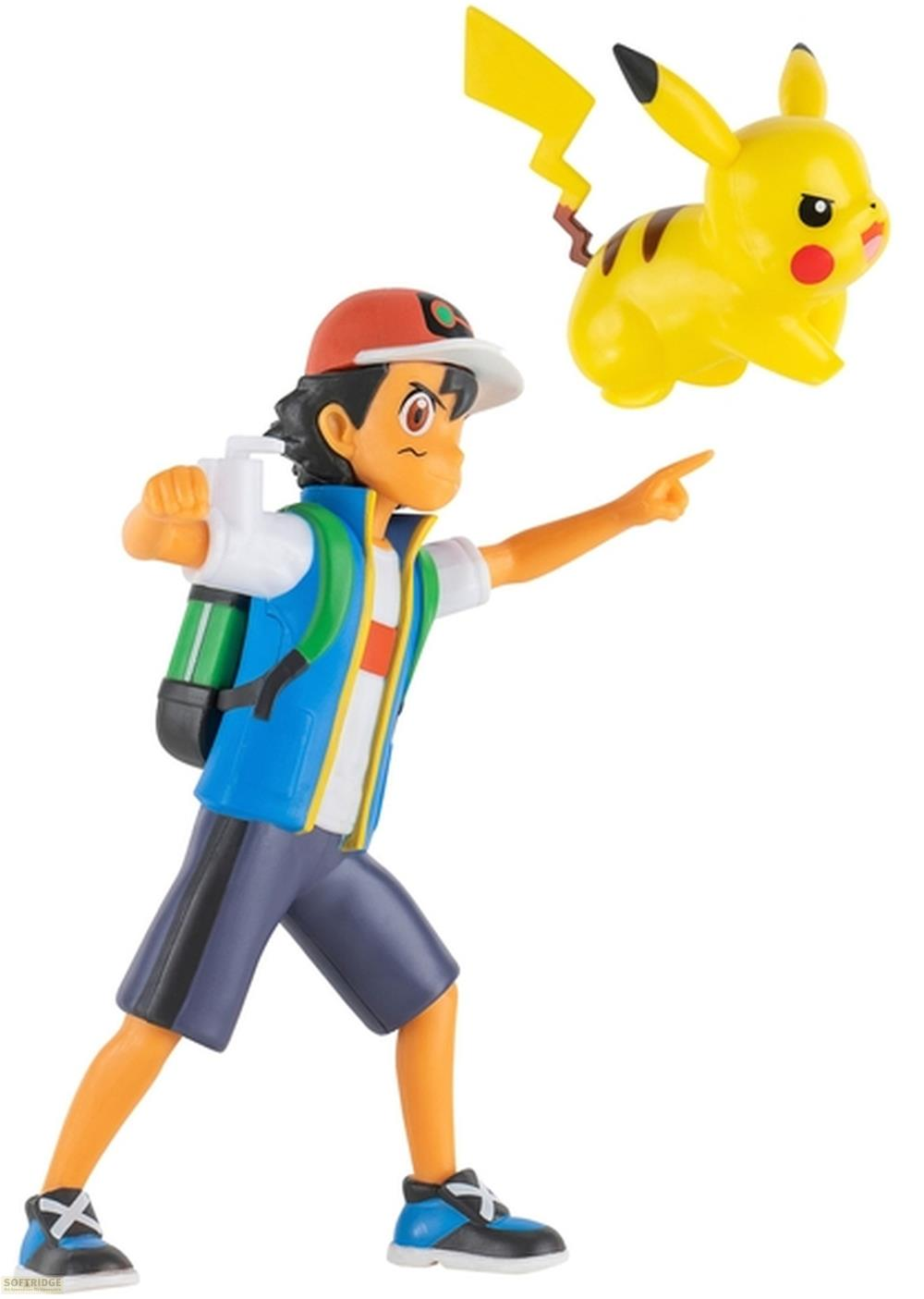 Figur von Ash Ketchum in blauer Weste und roter Kappe, der mit dem Finger zeigt, und eine kleine Pikachu-Figur daneben.