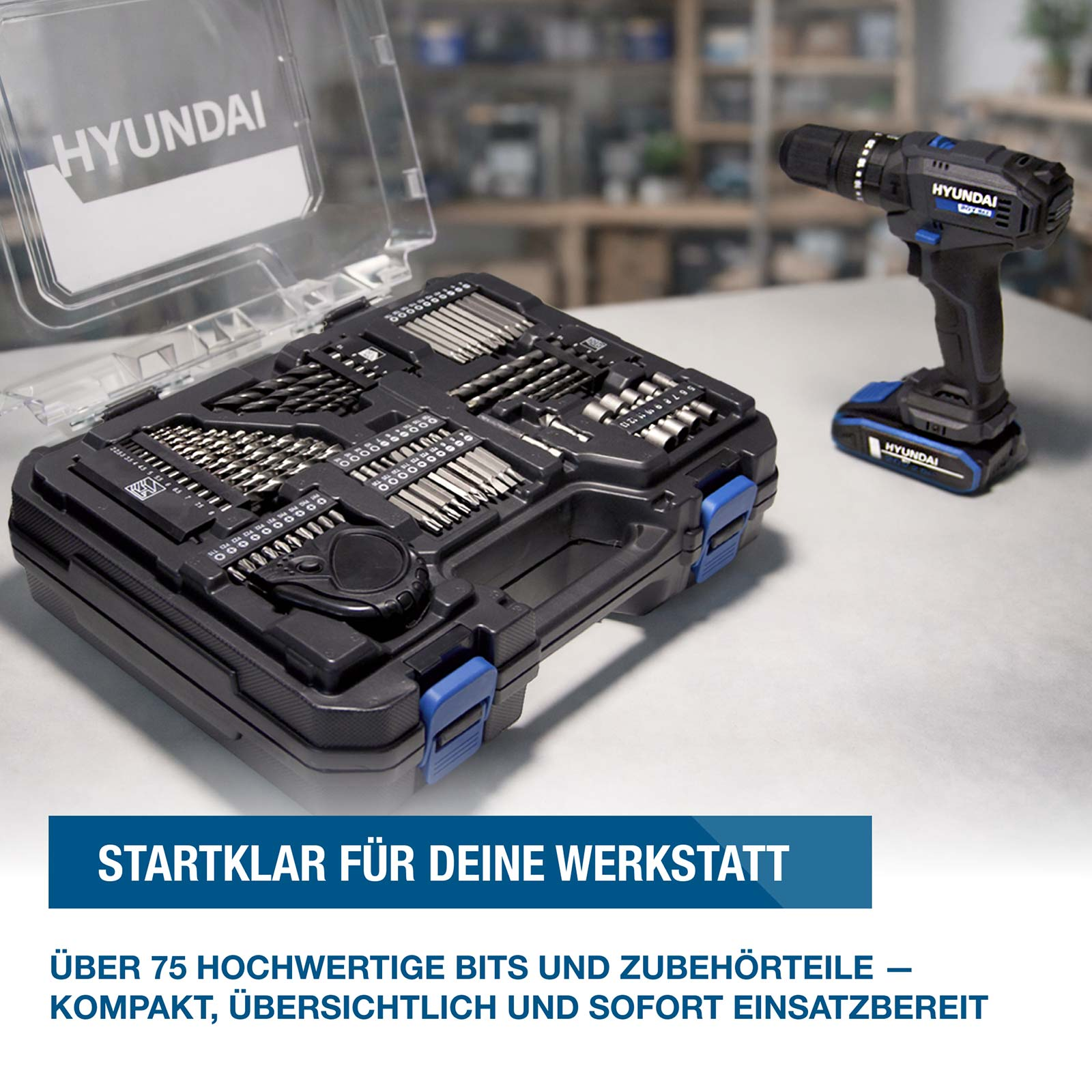 Hyundai Akkuschrauber und schwarzer Werkzeugkasten mit Bits und Zubehör auf einer Werkbank.