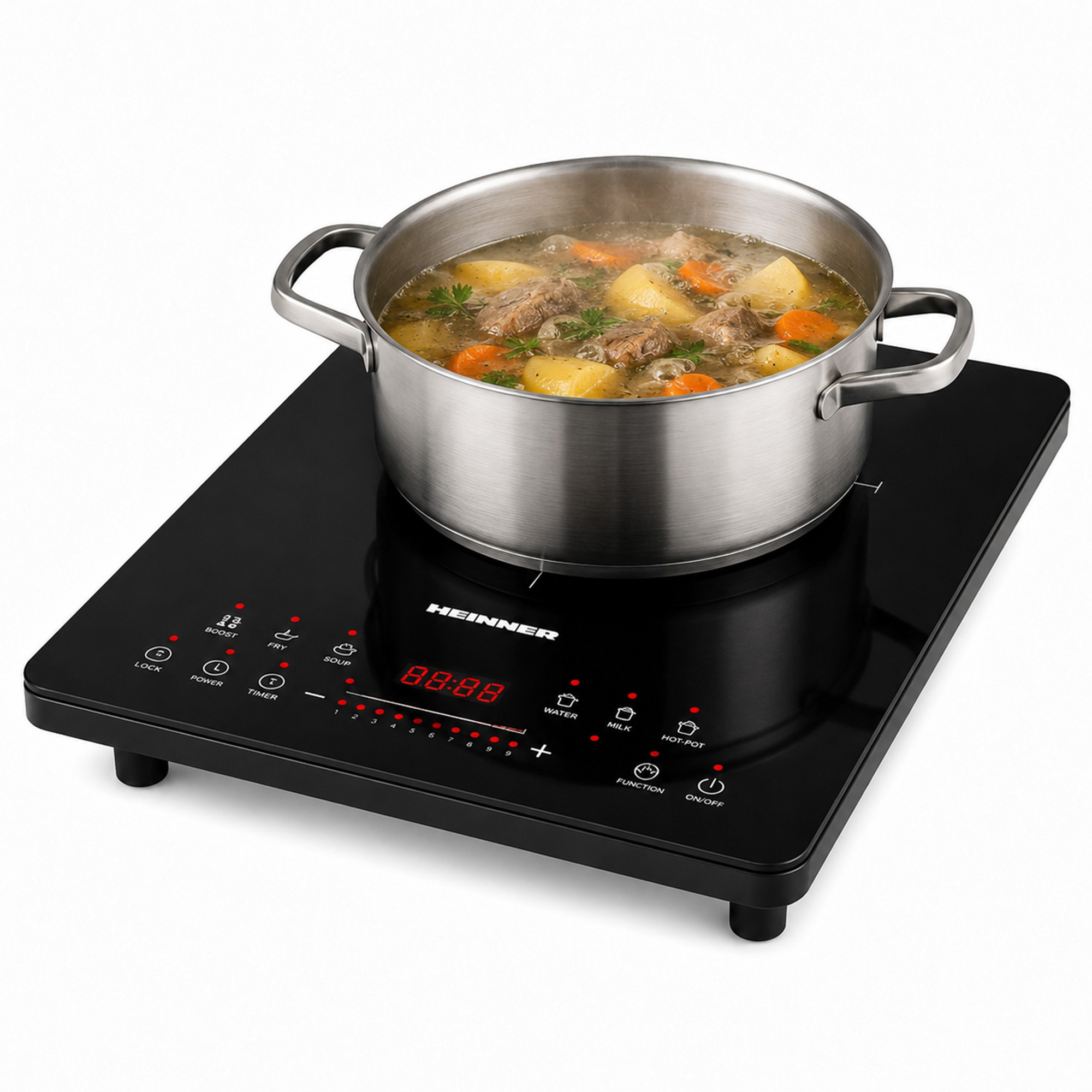 A metal pot with vegetable and meat soup is cooking on a black induction cooktop.