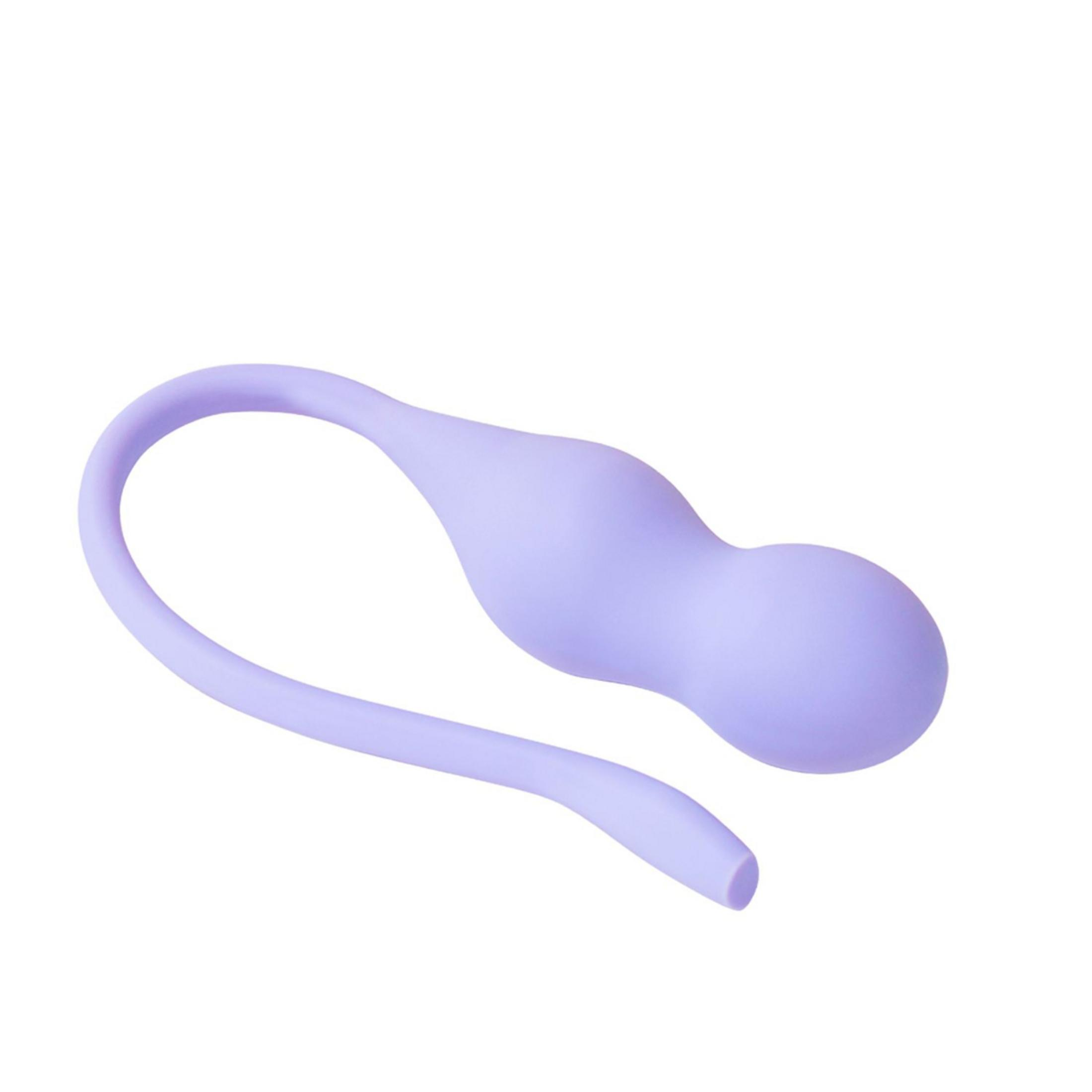 Ein glattes, lavendelfarbenes Wellness-Accessoire mit zwei Kugeln und einer gebogenen Lasche auf weißem Hintergrund.
