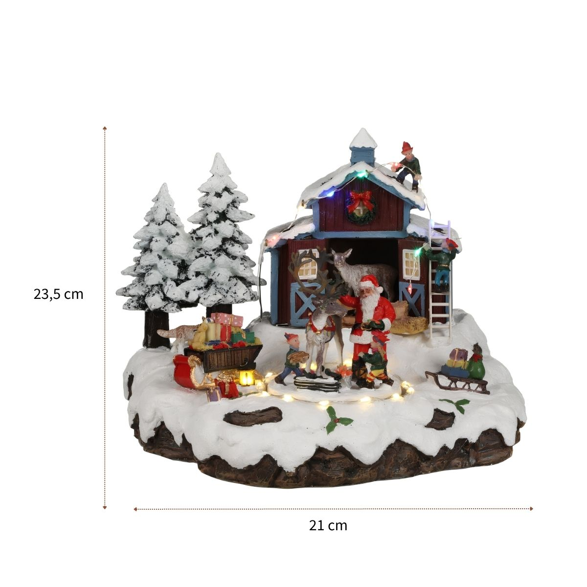 Figurine de village de Noël avec Père Noël, renne, arbres enneigés et grange éclairée, 21x23,5 cm.