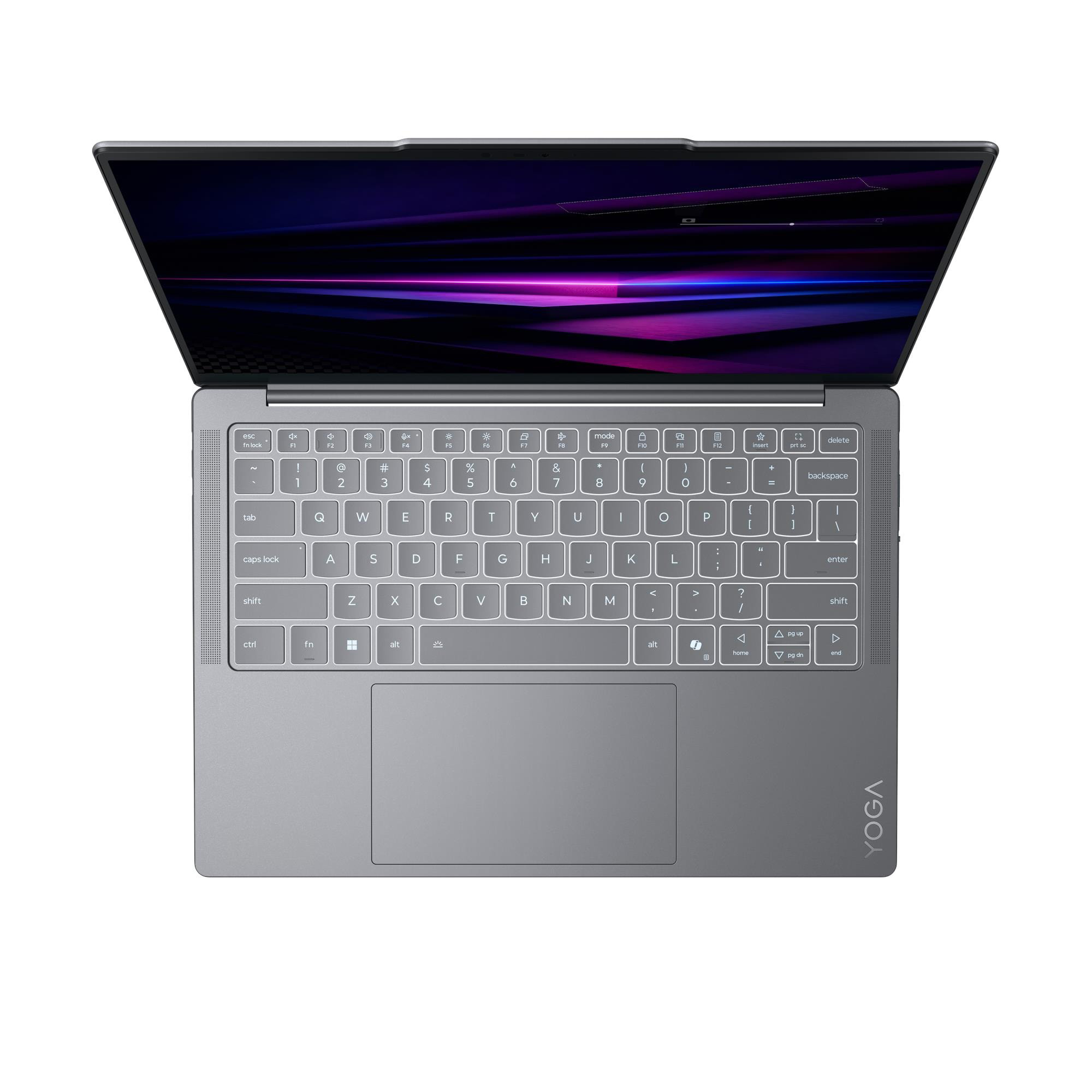 Un computer portatile grigio aperto con tastiera retroilluminata e uno schermo che mostra un'immagine astratta.