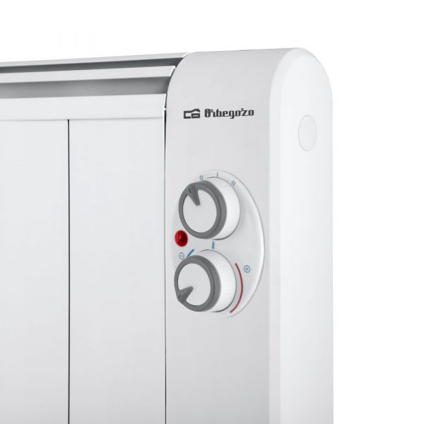 Primo piano del pannello di controllo di un termosifone elettrico bianco con due manopole grige e una spia rossa.