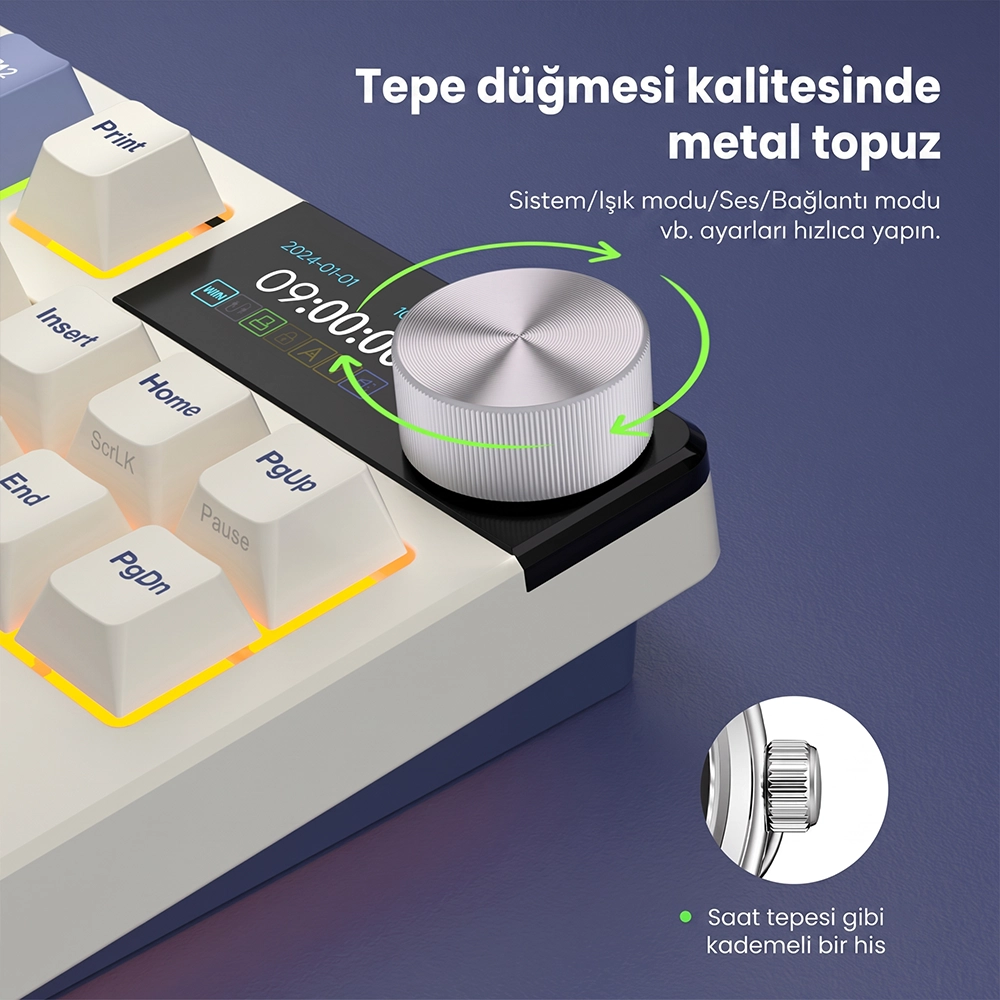 Klawiatura z małym ekranem i srebrnym metalowym pokrętłem.