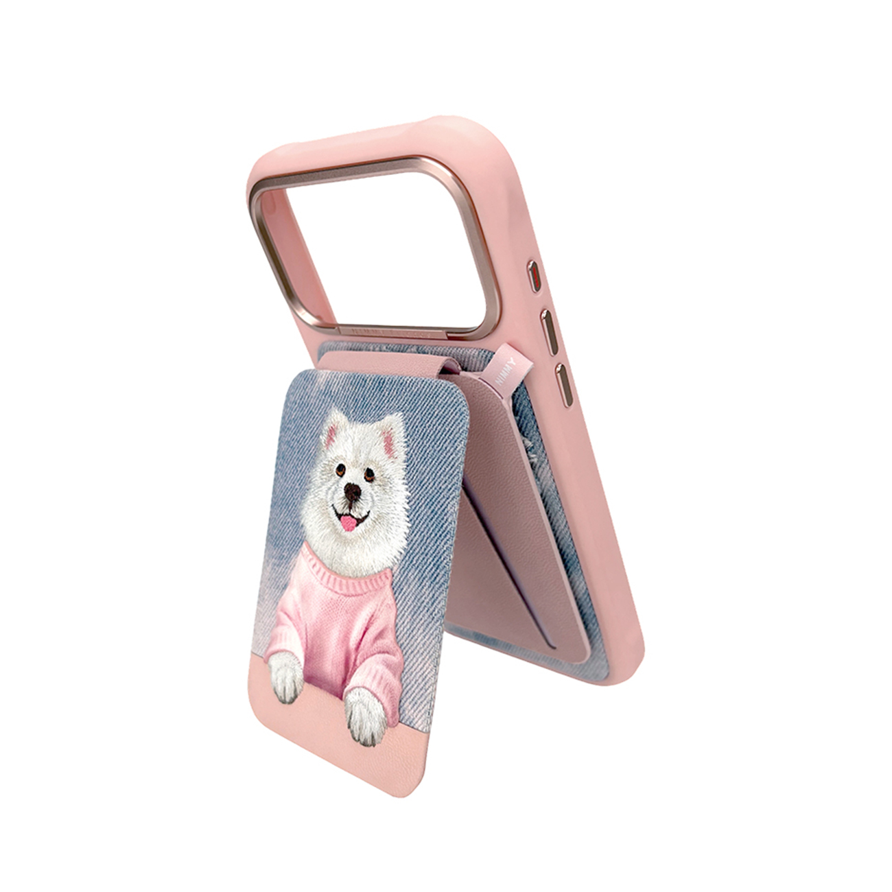 Funda de teléfono rosa con soporte y un perro blanco con suéter rosa sobre fondo de mezclilla.