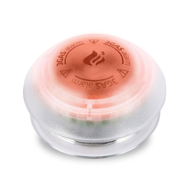 Ein runder, roter 3Gas Alarm Sensor mit einem klaren Kunststoffgehäuse auf weißem Hintergrund.