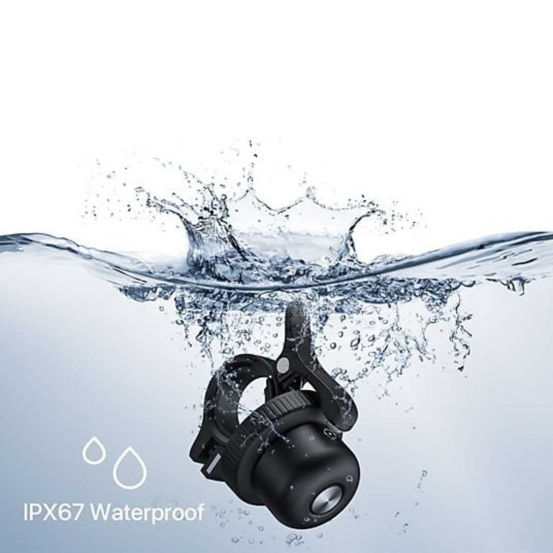 Waterproof bicycle bell plunging into water, creating a big splash.