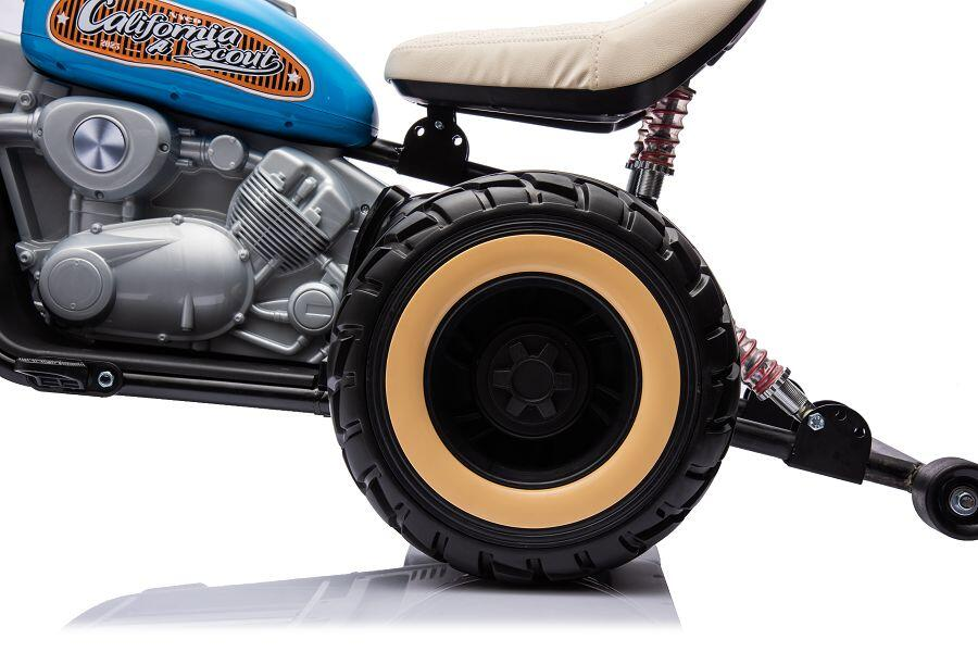 Blaue Kindermotorrad-Hälfte mit beigem Sitz und grossem Hinterrad.