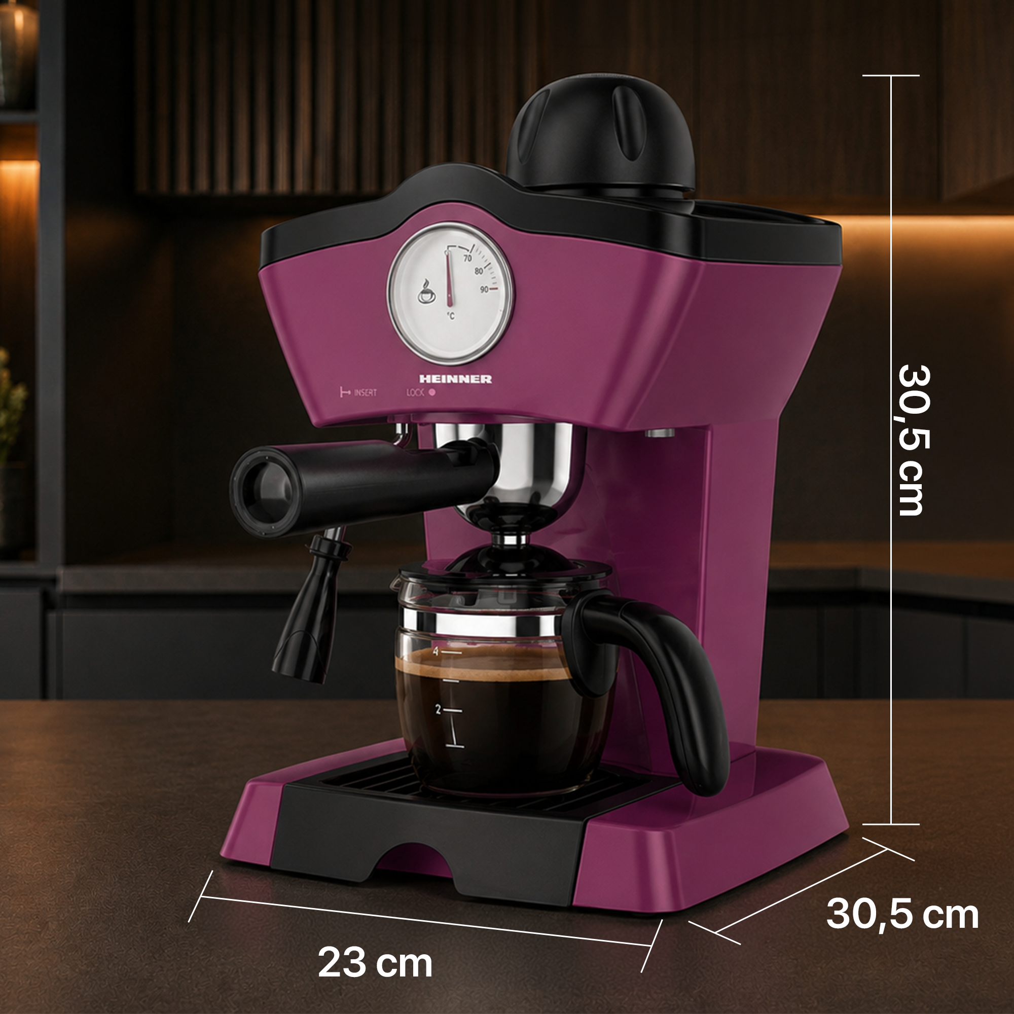 Purple espresso machine on dark surface with dimension indicators.
