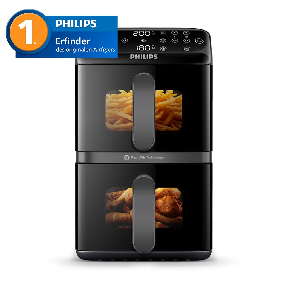 Una friggitrice ad aria Philips nera a doppio cestello con patatine sopra e pollo sotto.