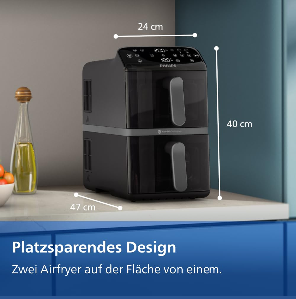 Friggitrice ad aria Philips nera con due scomparti impilati su un piano cucina con relative misure.