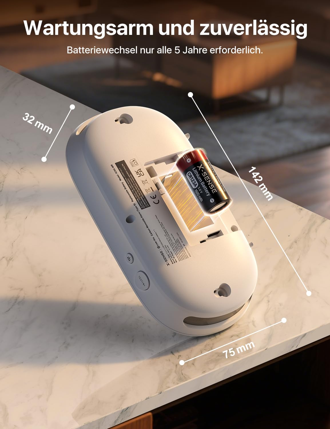 Appareil blanc avec dimensions, montrant l'emplacement de la pile sur du marbre.